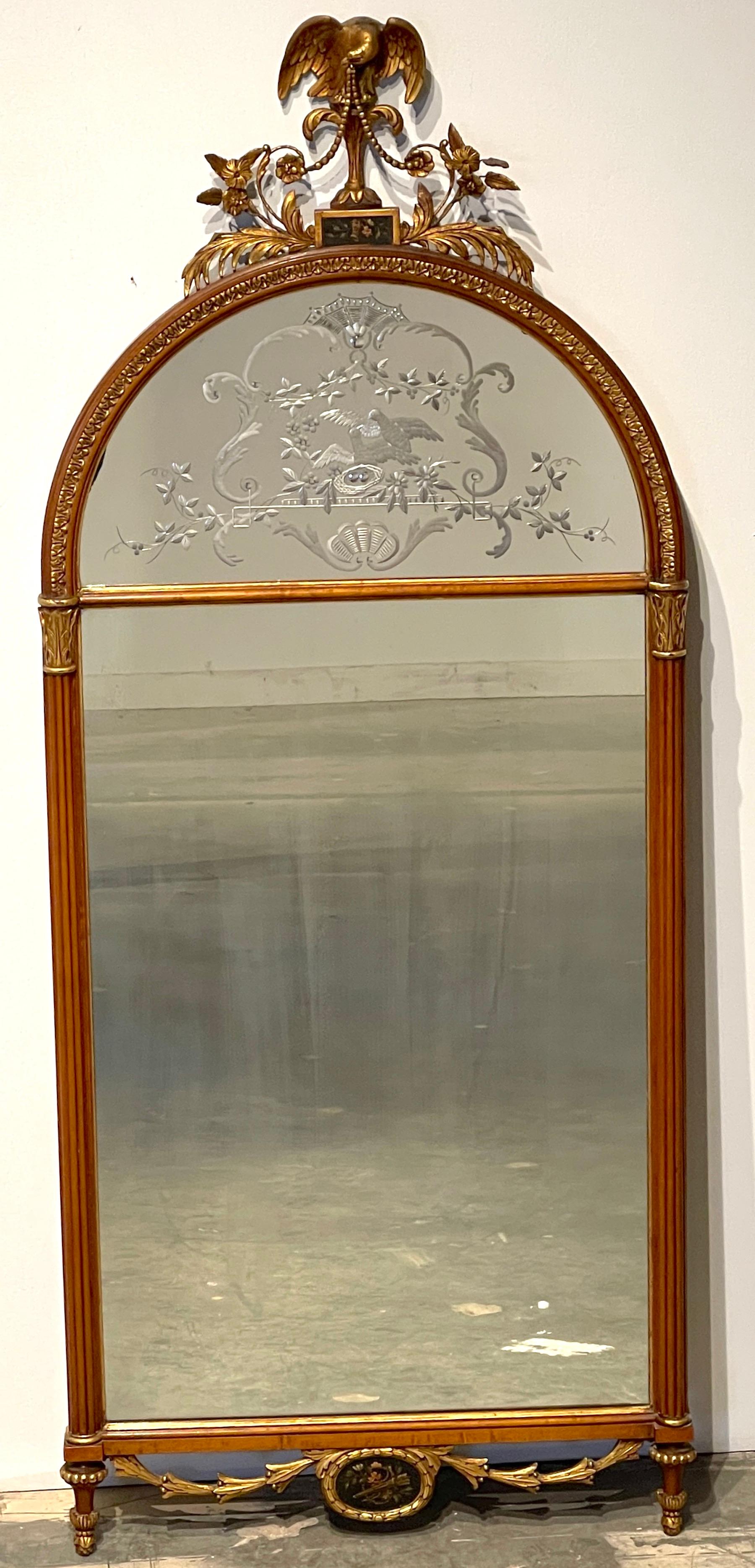 Stunning Adams Style Carved & Painted Satinwood Engraved mirror
England, 1925 

A fine example of an early 20th century English Adam style mirror, featuring numerous signature elements. The top is adorned with a finely carved giltwood eagle with