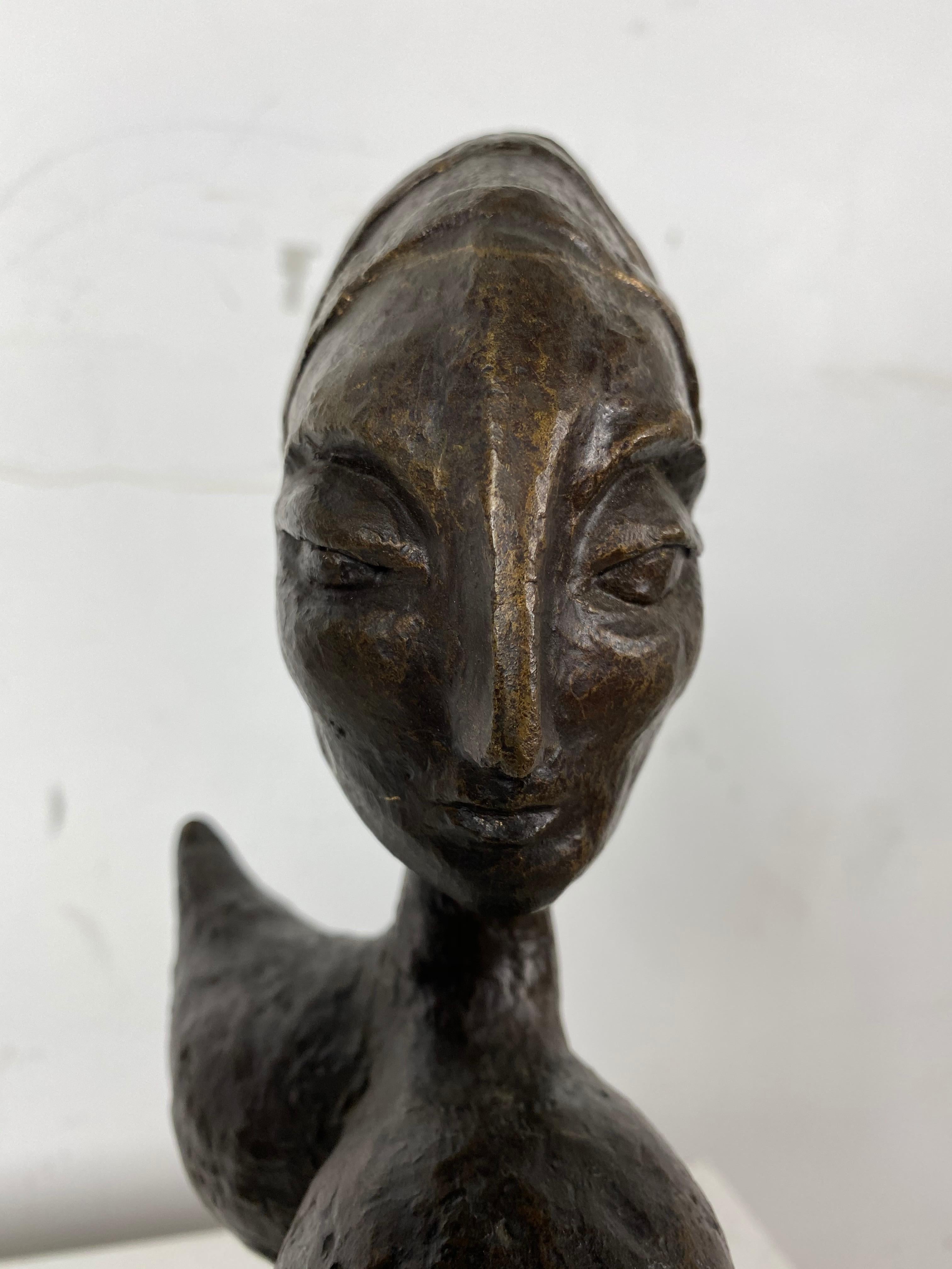 Stunning African abstract bronze seated woman, unsigned, amazing design, form, patina.