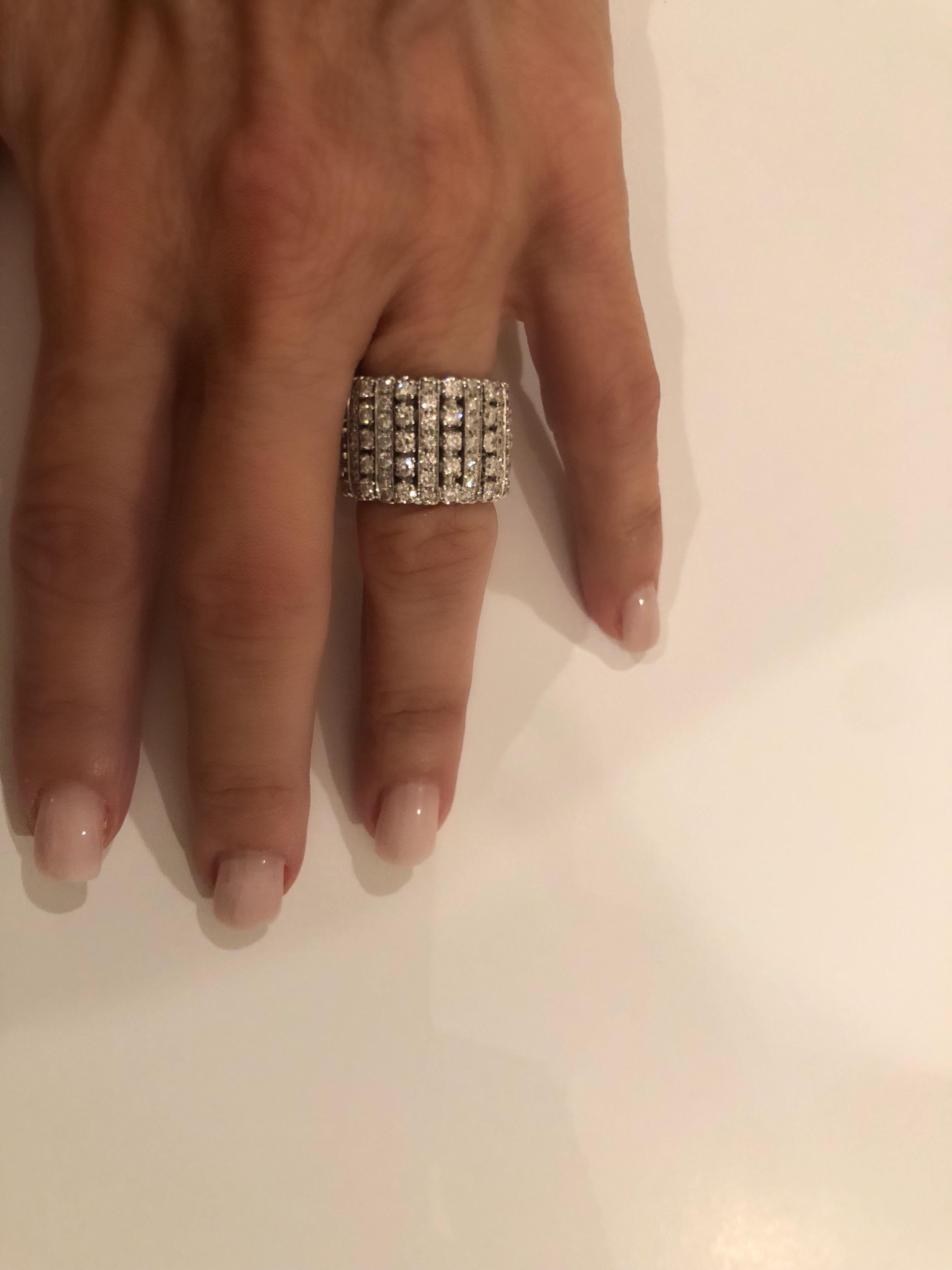 Stunning 18k white gold all diamond eternity band,
approximately 4+ carat G-H , VS1-VS2 diamonds. 
A true statement- 