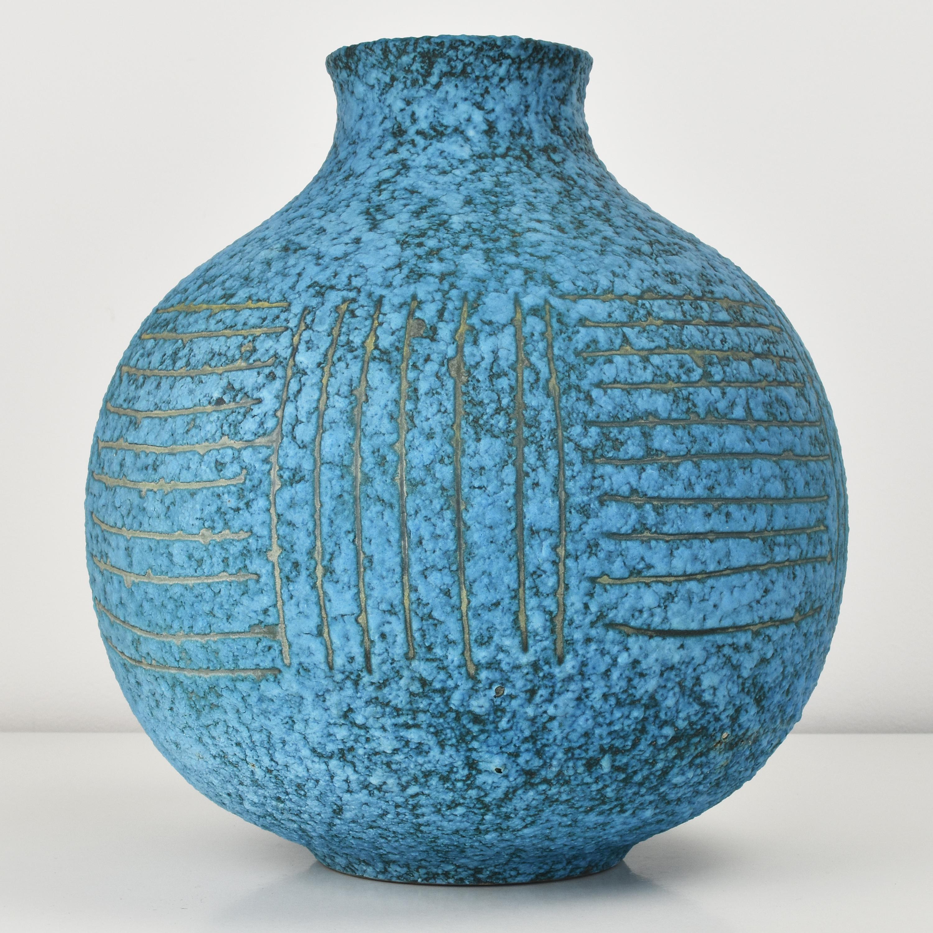 In our opinion, one of the most stunning pieces by Alvino Bagni ever. This brightly turquoise fat lava glazed pottery vase with irregular regular incised 