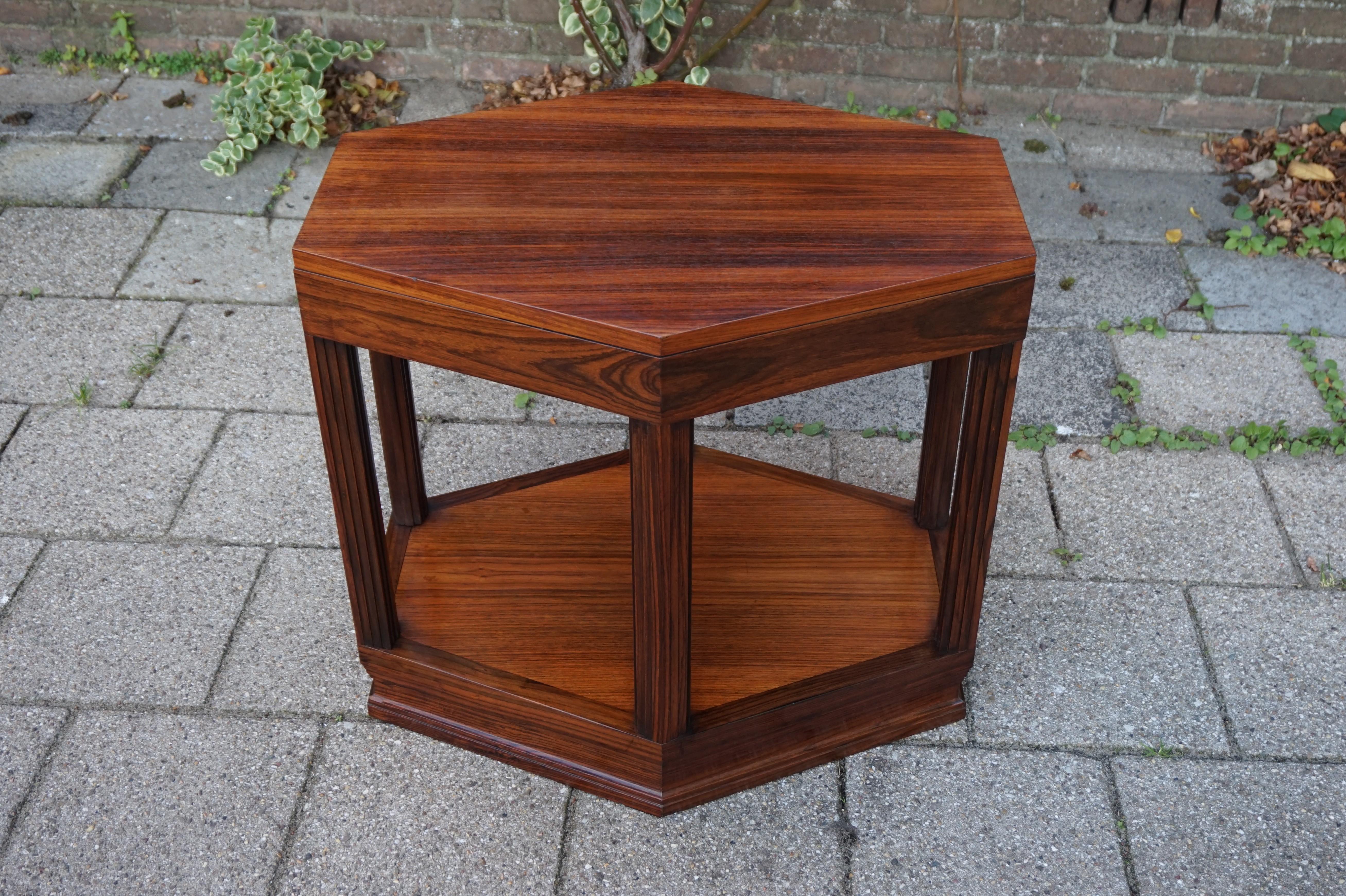 Marvelous materials AND design, Art Deco table.

When we first saw this stunning coffee table we immediately knew it had to be ours. We didn't hesitate, because this is the type of antique that -both in terms of design and condition- you only come