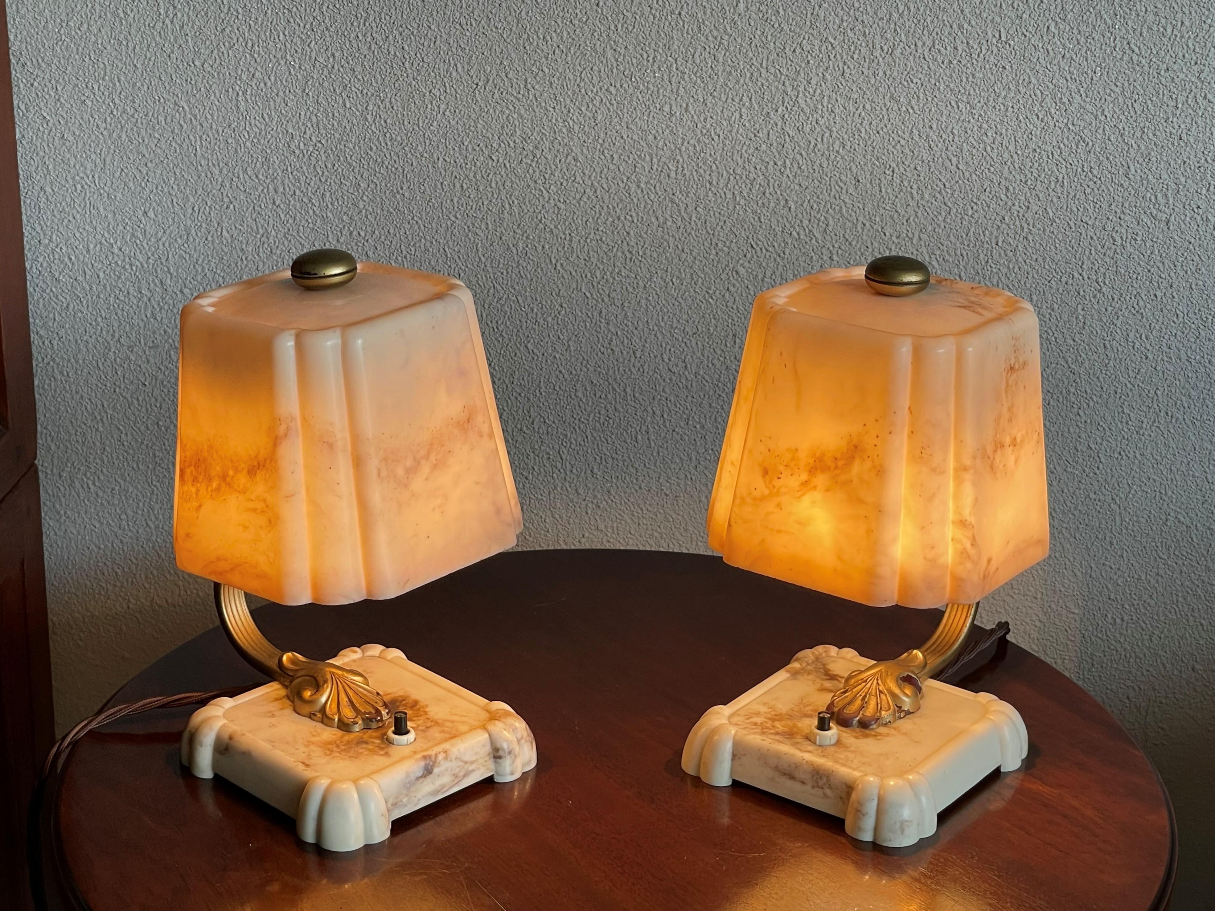 Very rare and great looking pair of real Bakelite lamps.

With early twentieth century lighting being one of our specialties, we know how hard it is to find pairs of Art Deco era table lamps. To have found a matching pair of Bakelite ones (!) in the