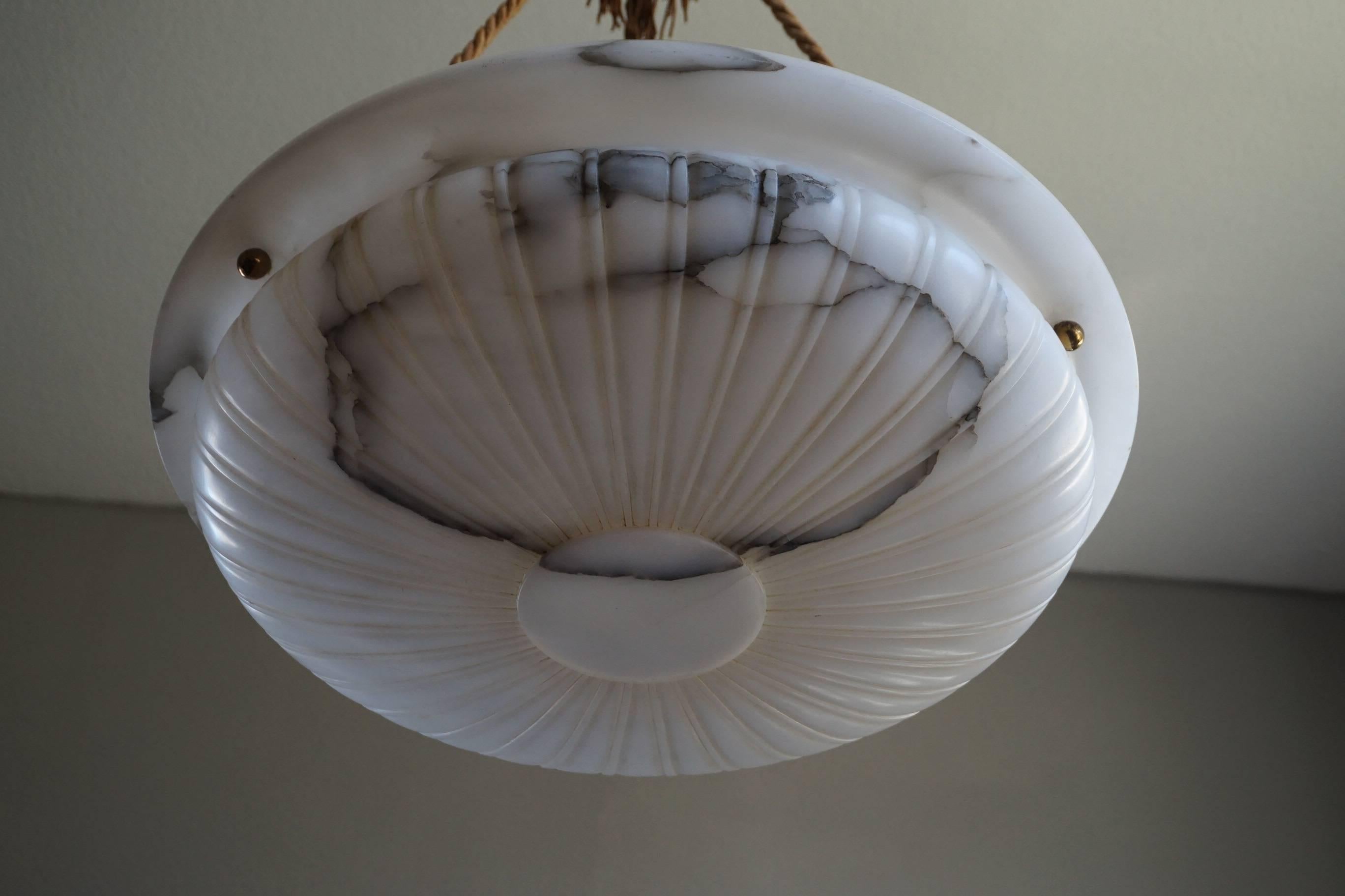 Great shape and size alabaster pendant with dito canopy.

This remarkable pendant of classical beauty and elegance is one of the most striking and best condition alabaster pendants we have had the privilege of offering. Apart from some truly minor