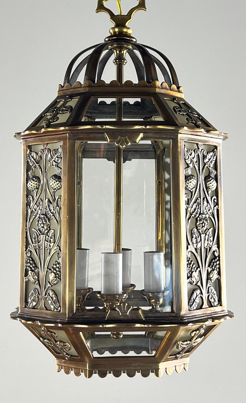 

Lovely commercial bronze eight sided Art Deco lantern in the style of Oscar Bach. It was a high end light in its day and would have been reserved for either a commercial space or an upscale home. The lantern features cast floral panels, original