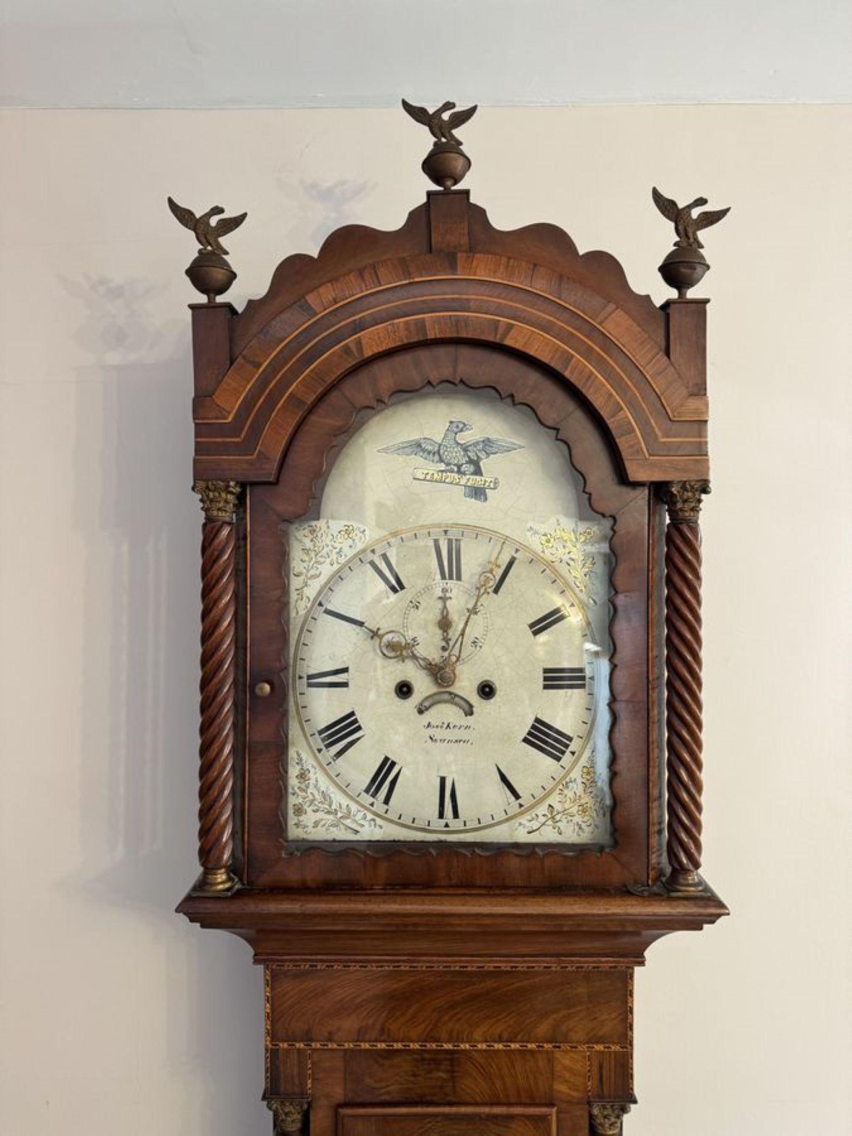 Stunning antique 19th Century quality mahogany 8 day longcase clock, having a shaped top with three original finales, rope twist columns to the sides of the hood, a mahogany door to the centre of the case flanked by rope twist columns, standing on
