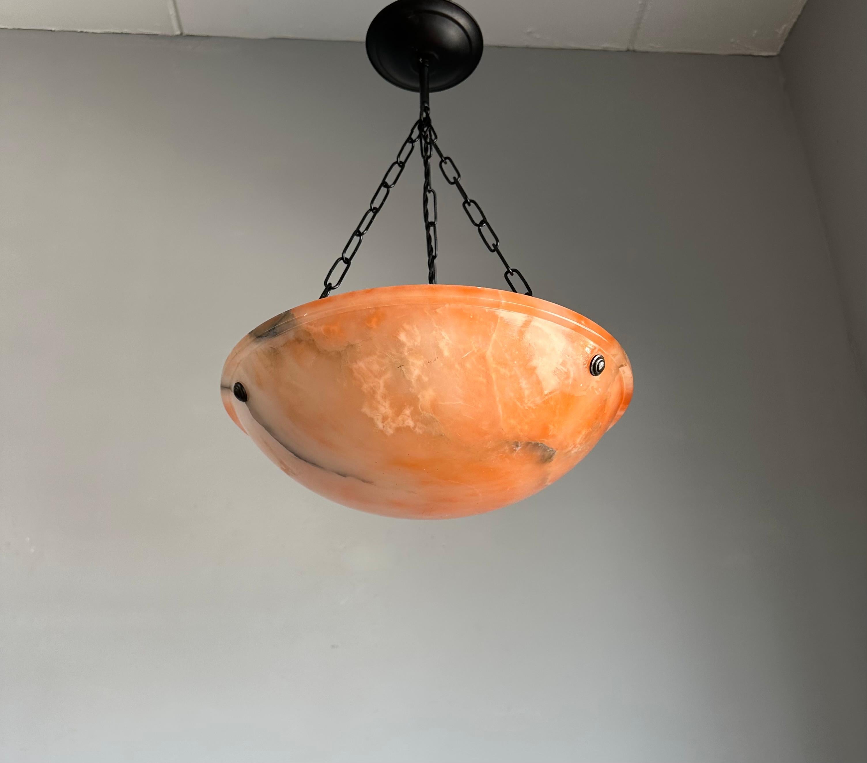 Great shape and warmest color alabaster light.

If you are looking for a truly beautiful, great quality and very good condition alabaster pendant then this striking specimen could be the one or you. This regular size, but stunning design and great