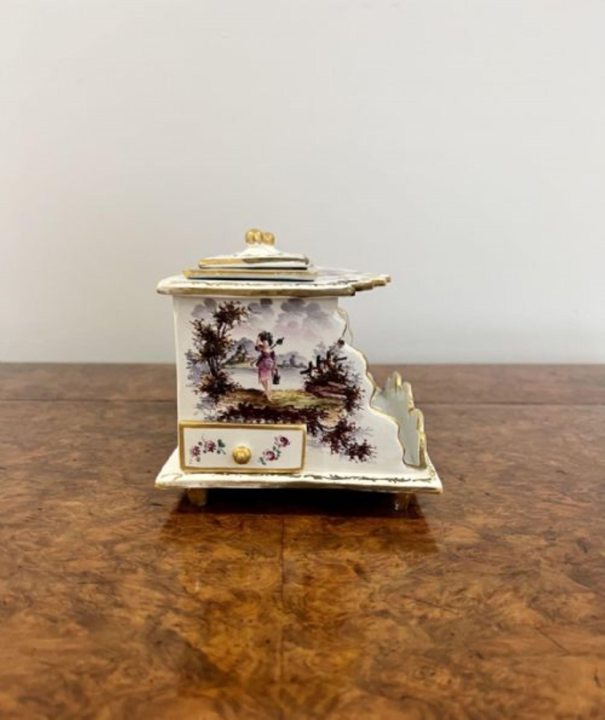 Stunning antique continental porcelain inkstand having a stunning quality continental inkstand, rococo style with figural scenes and flowers covering the inkstand with two covered removable inkwells to the top and a drawer either side of the