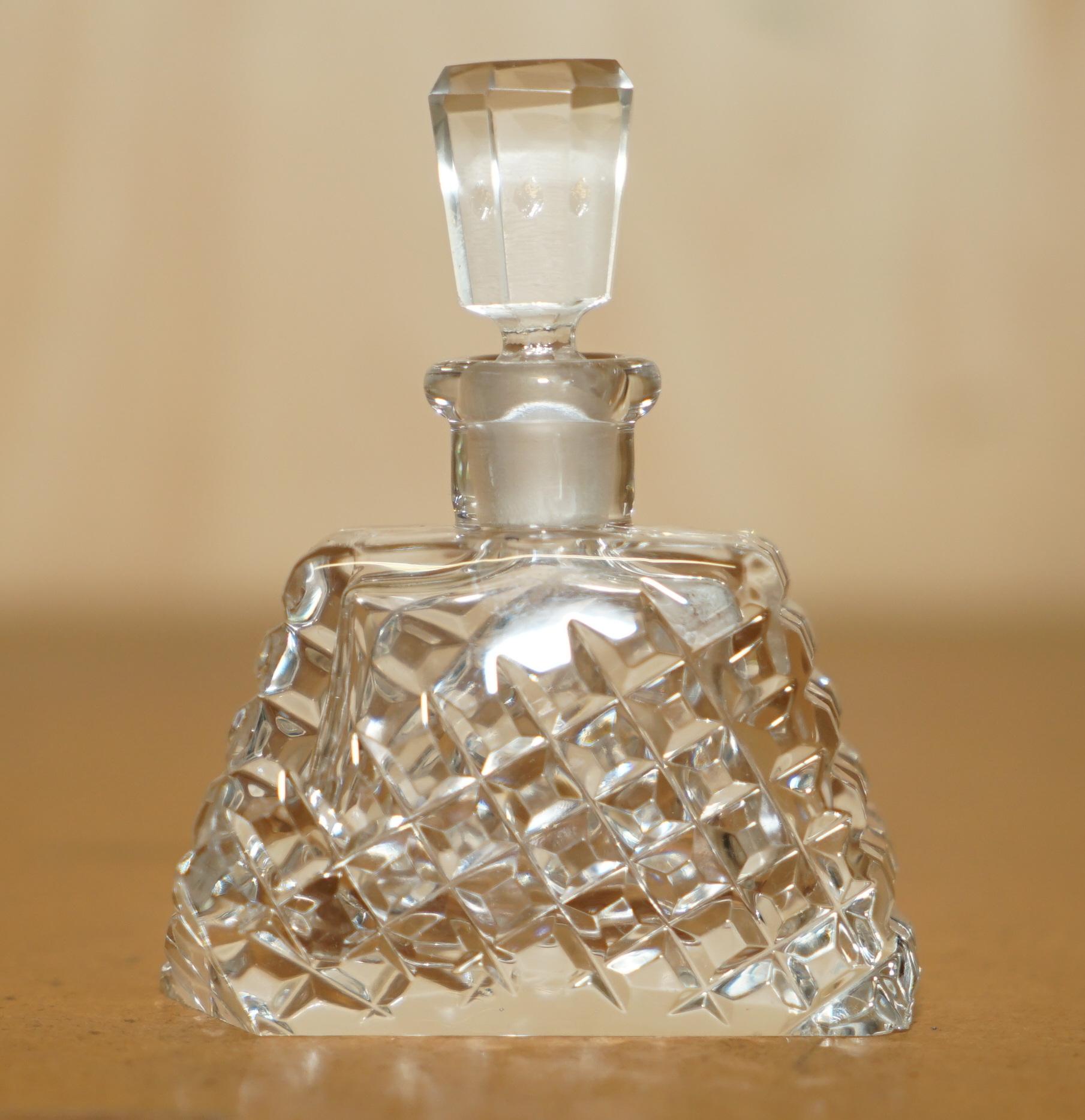 Royal House Antiques

Royal House Antiques is delighted to offer for sale this stunning original circa 1920 Art Deco cut glass Crystal perfume bottle

A very good looking well made and decorative piece, the main body and stopper are heavily cut