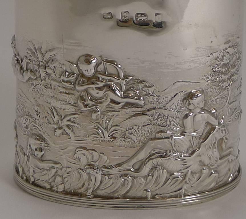 A stunning English Edwardian tea caddy made from solid English silver with repousse or embossed decoration. Looking at the decoration the two figures look to be Poseidon and Aphrodite served by a series of Cherubs or Putti figures.

The silver is