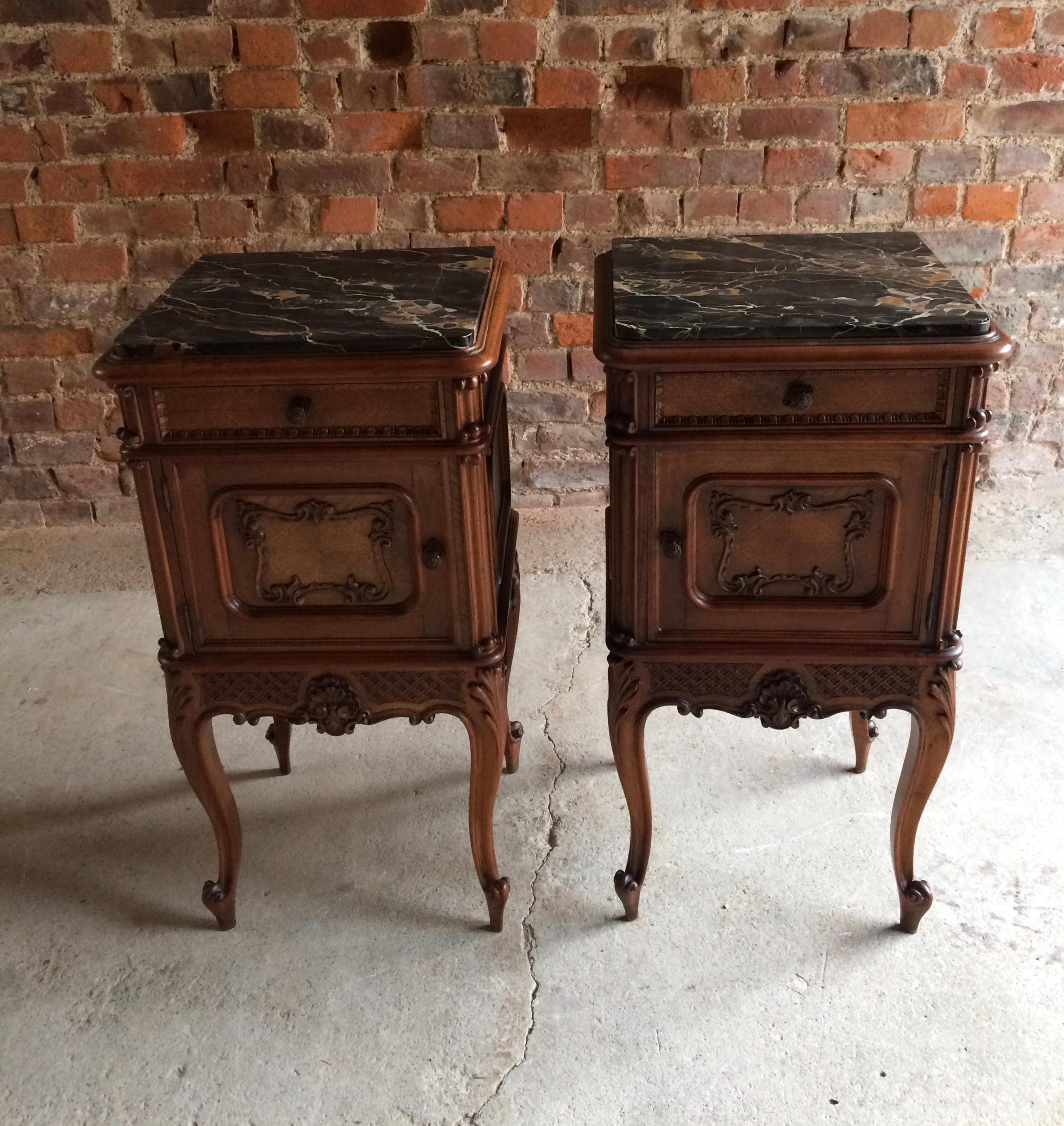 A stunning and truly magnificent pair of antique 19th century French marble topped bedside cabinets / night stands dating from the late 19th century to circa 1890, the tops with inlaid cream and red veined black marble over a single pull out drawer