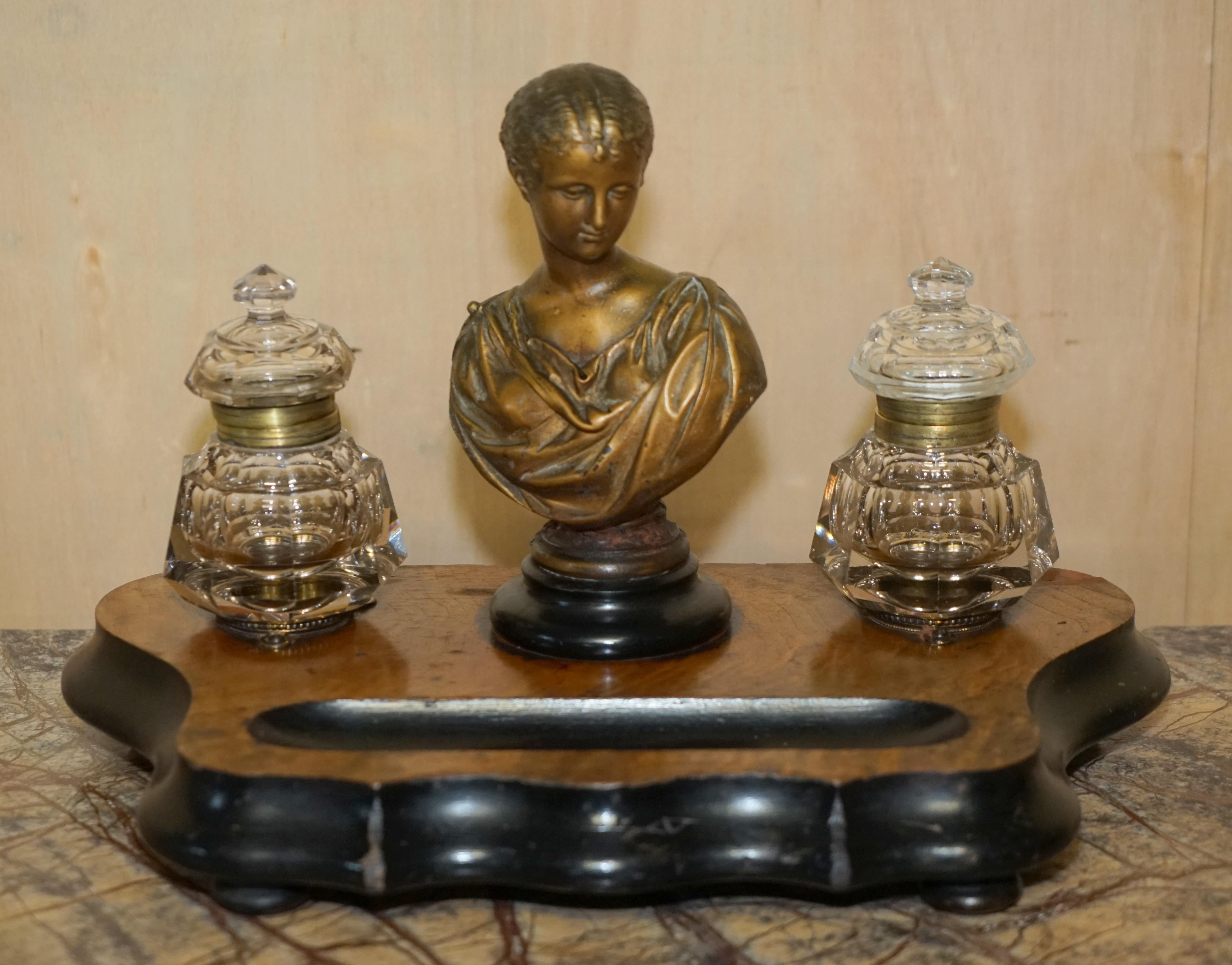 Royal House Antiques

Royal House Antiques is delighted to offer for sale this lovely 19th century French bronze ink well stand

A good looking well made and decorative desk top ink well pair on stand with French bronze statue

The condition