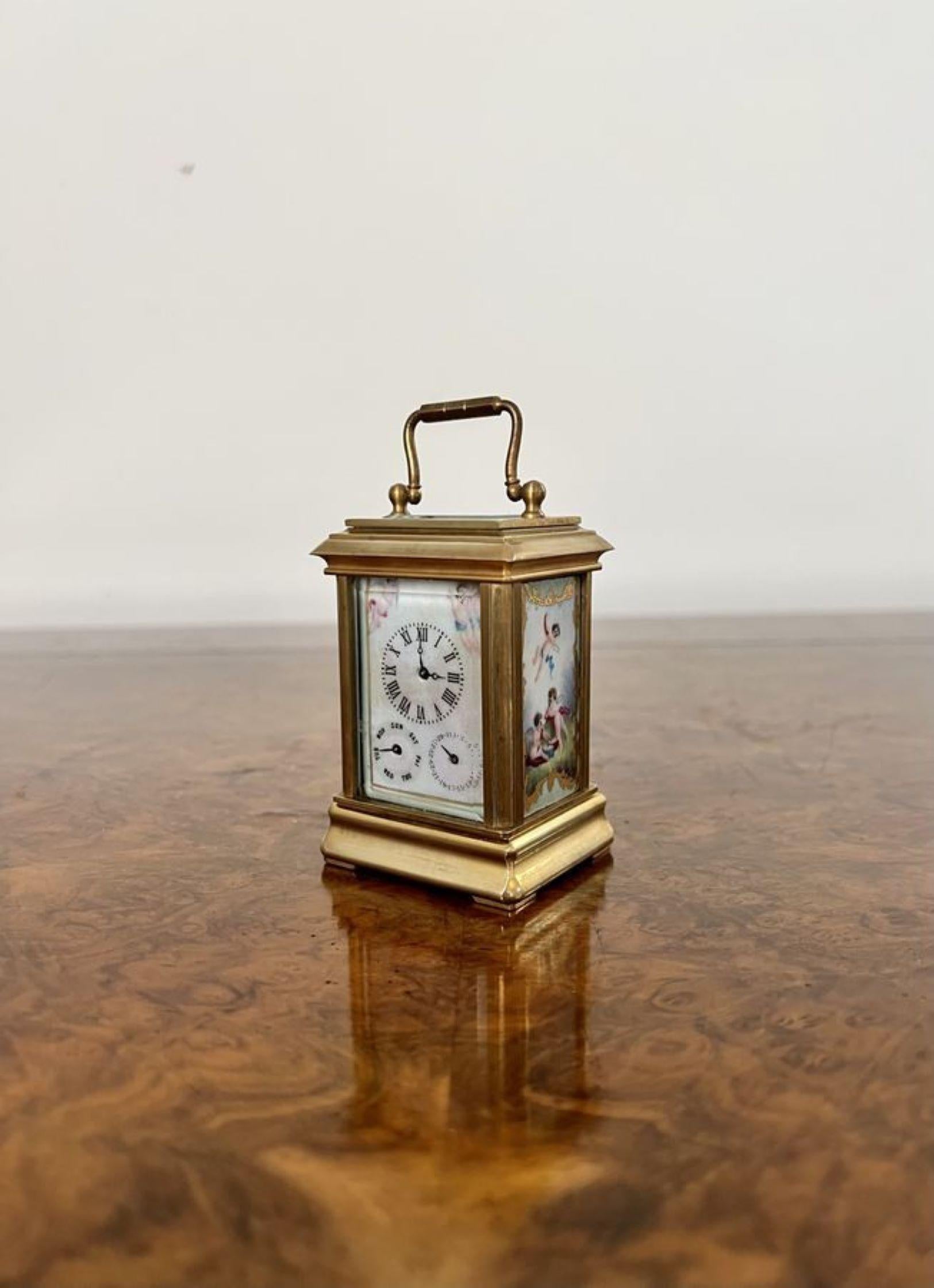 Stunning antique miniature quality brass carriage clock with hand painted porcelain panels having a day and date dial, wonderful hand painted porcelain panels decorated with cherubs in fantastic green, blue, red and white colours with gold gilded