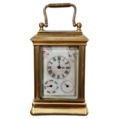 Stunning Used miniature quality brass carriage clock with hand painted porcel
