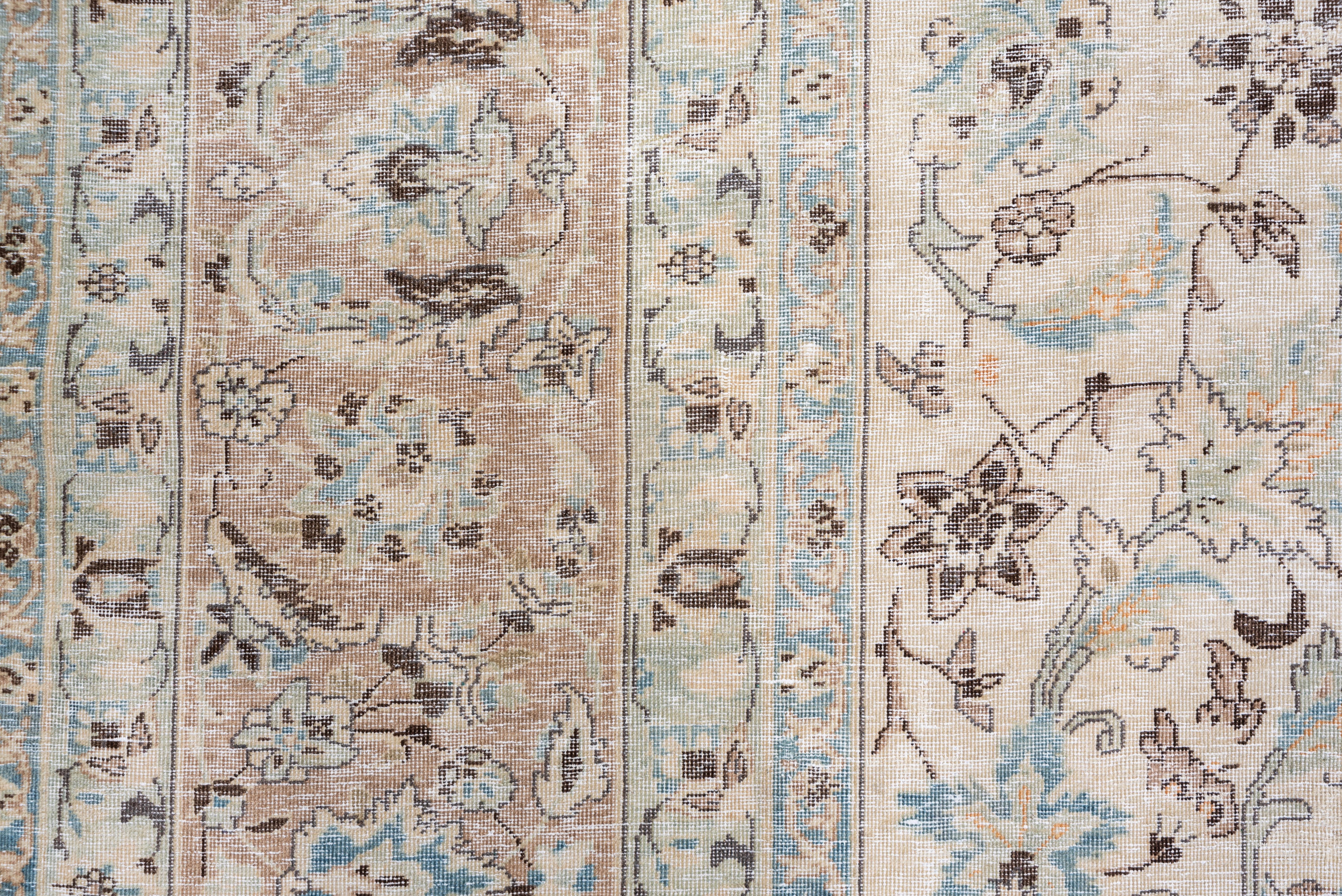 The sand ground of this well-woven NW Persian city carpet shows a centered pattern of wiry and broader arabesques, regular leaf palmettes and oak leaf palmettes and tulips. A pendant small octogramme within a concave open diamond focuses the pattern