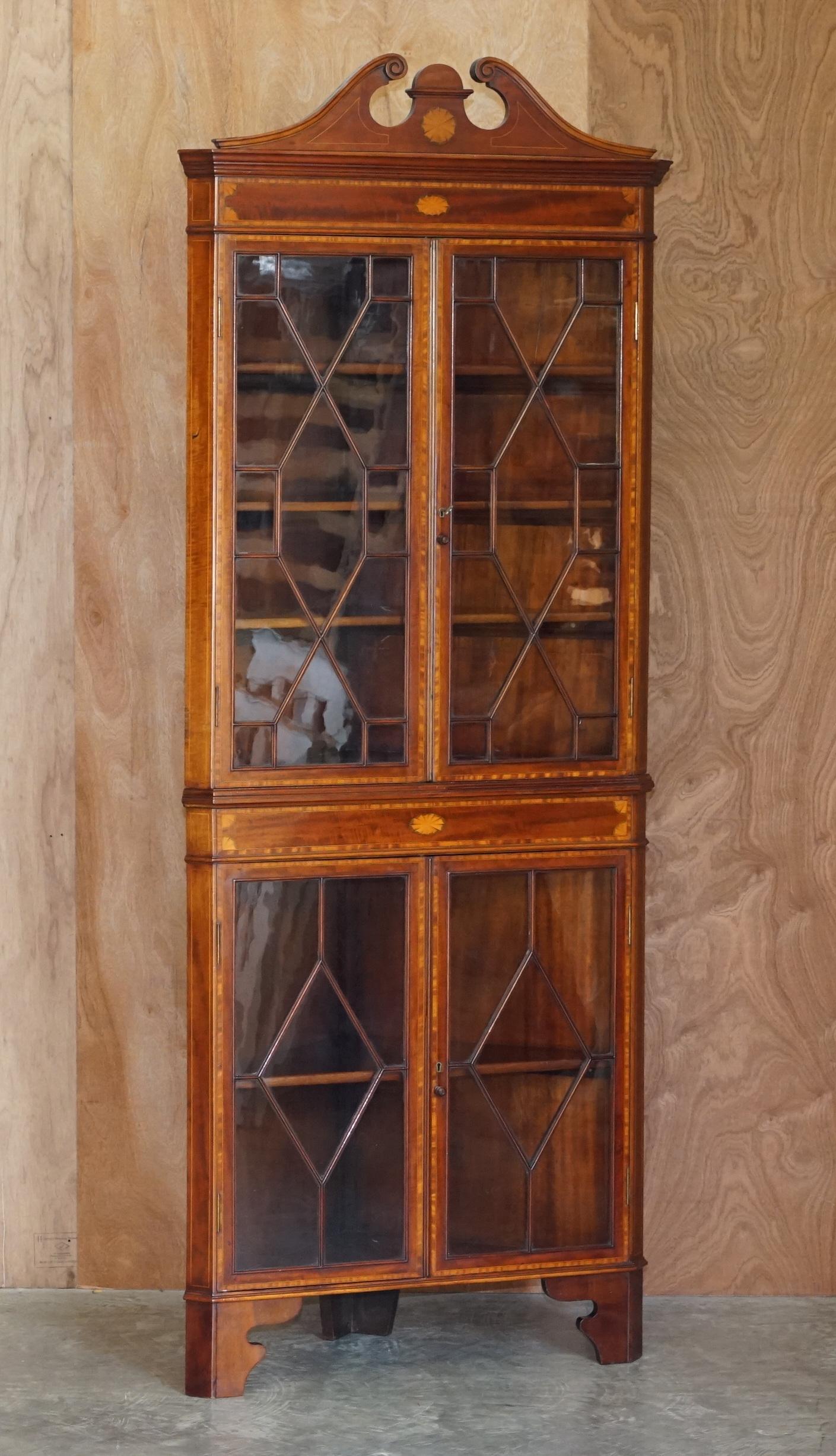 We are delighted to offer stunning Victorian Sheraton Revival corner bookcase with Astral glazed door and original key 

A very decorative piece, beautifully inlaid in Satinwood & Walnut, this piece is like pure art furniture. The astral glazed