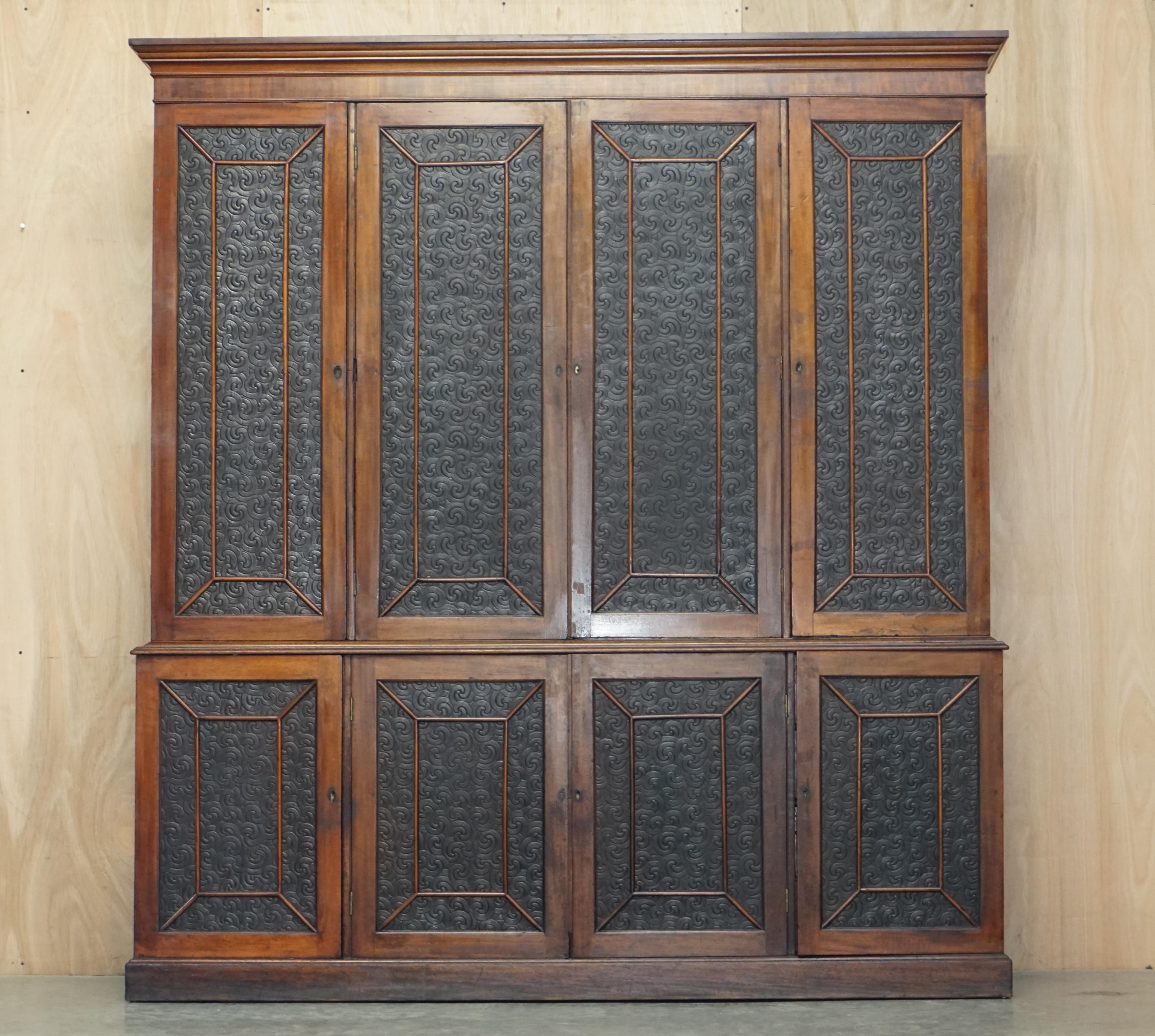 We are delighted to offer for sale this very rare and highly collectable, large mahogany framed with leather embossed panels library bookcase cupboard with build in drawers

Please note the delivery fee listed is just a guide, it covers within the