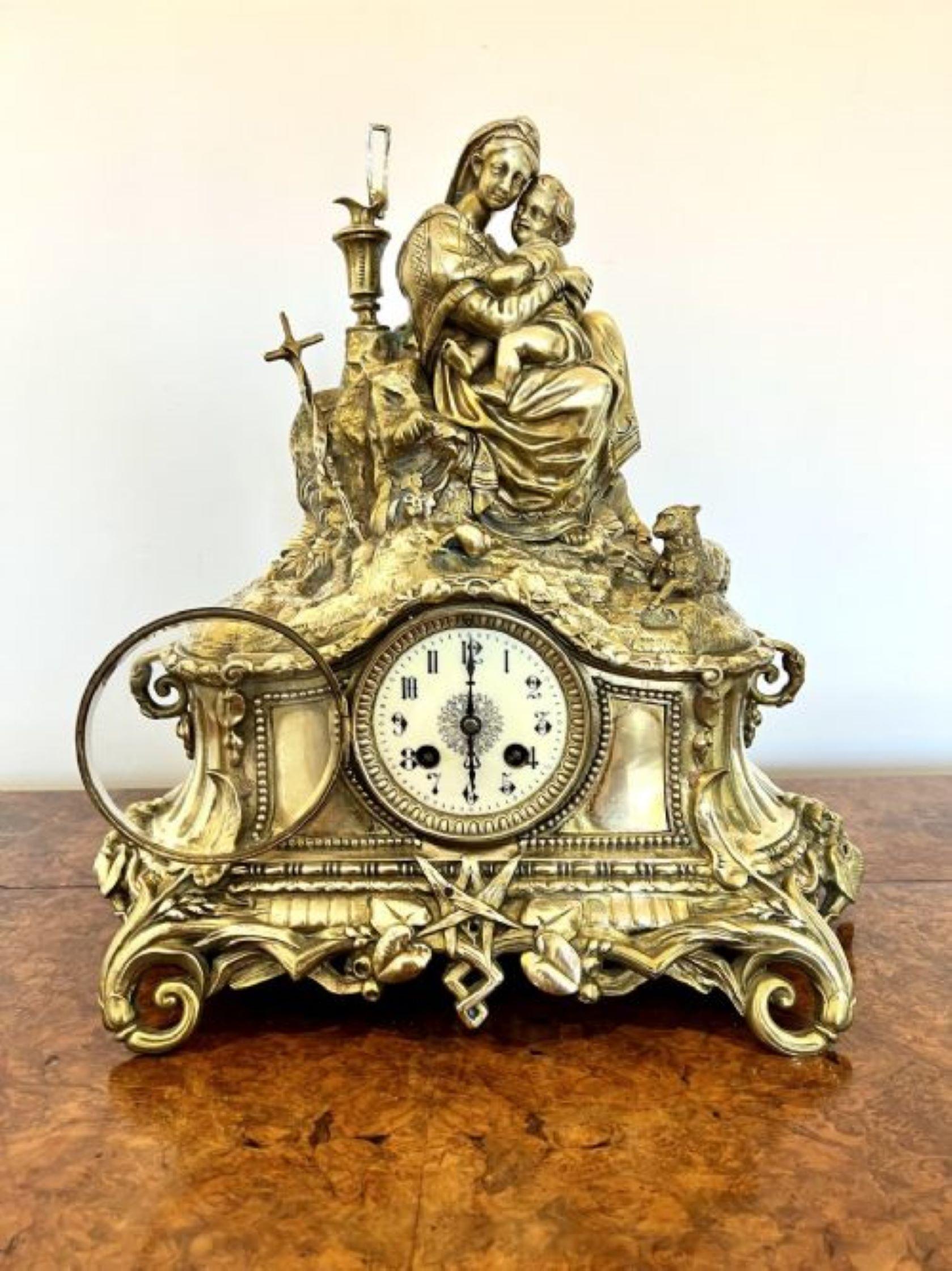 Stunning antique Victorian quality ornate brass mantle clock having a quality ornate brass case with two figures to the top surrounded by foliage and a sheep, with a circular porcelain dial, original hands an an eight day French movement striking