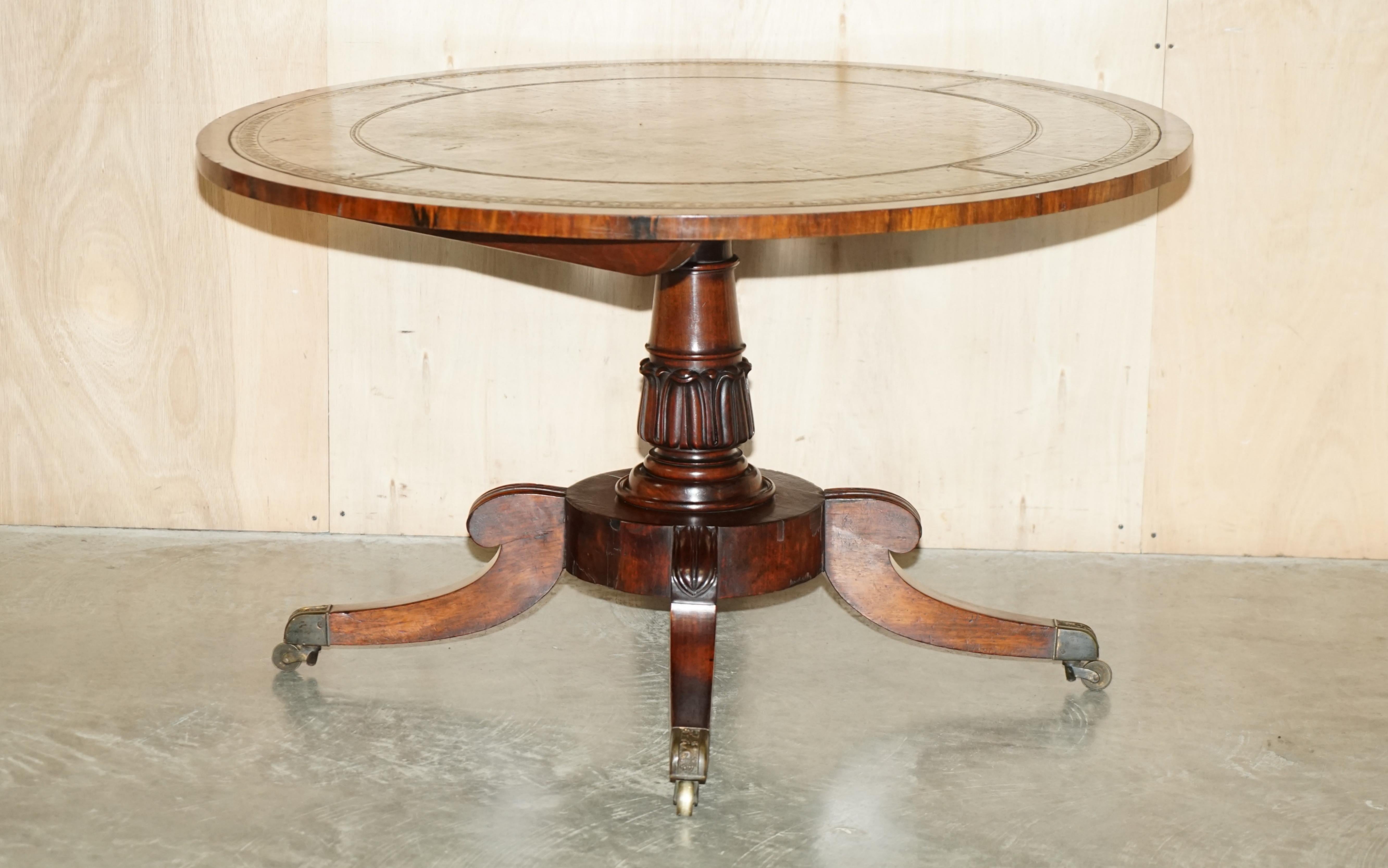 We are delighted to offer for sale this absolutely stunning original William IV Rosewood and gold leaf embossed green leather Library or dining table with ornately carved pedestal base and tilt top 

A very good looking well made and decorative