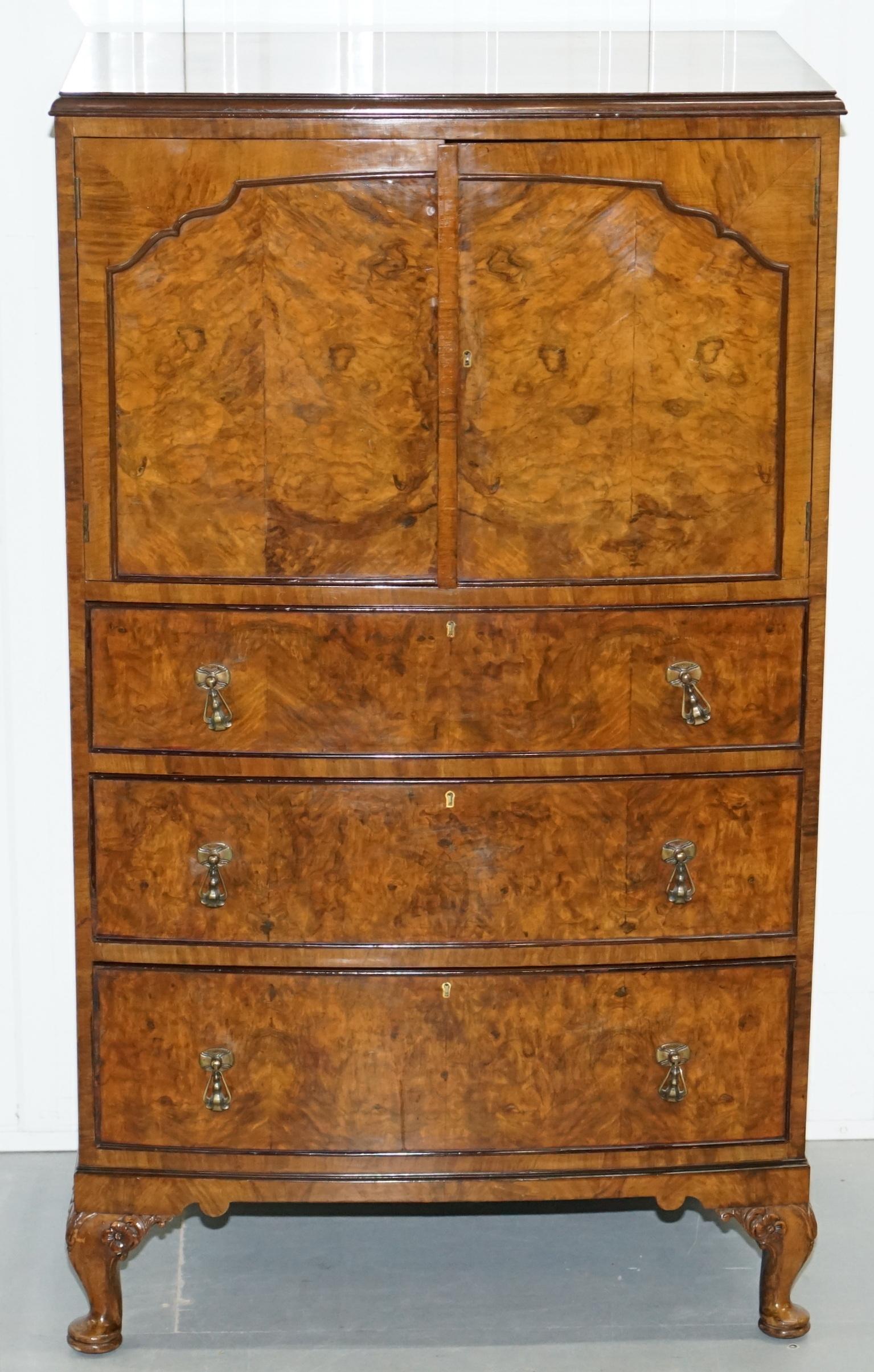 We are delighted to offer for sale this stunning Art Deco burr walnut cupboard with very good looking hand-carved legs

This is a very versatile handpiece of furniture, originally suited for dining room odds and sods, having drawers its one of