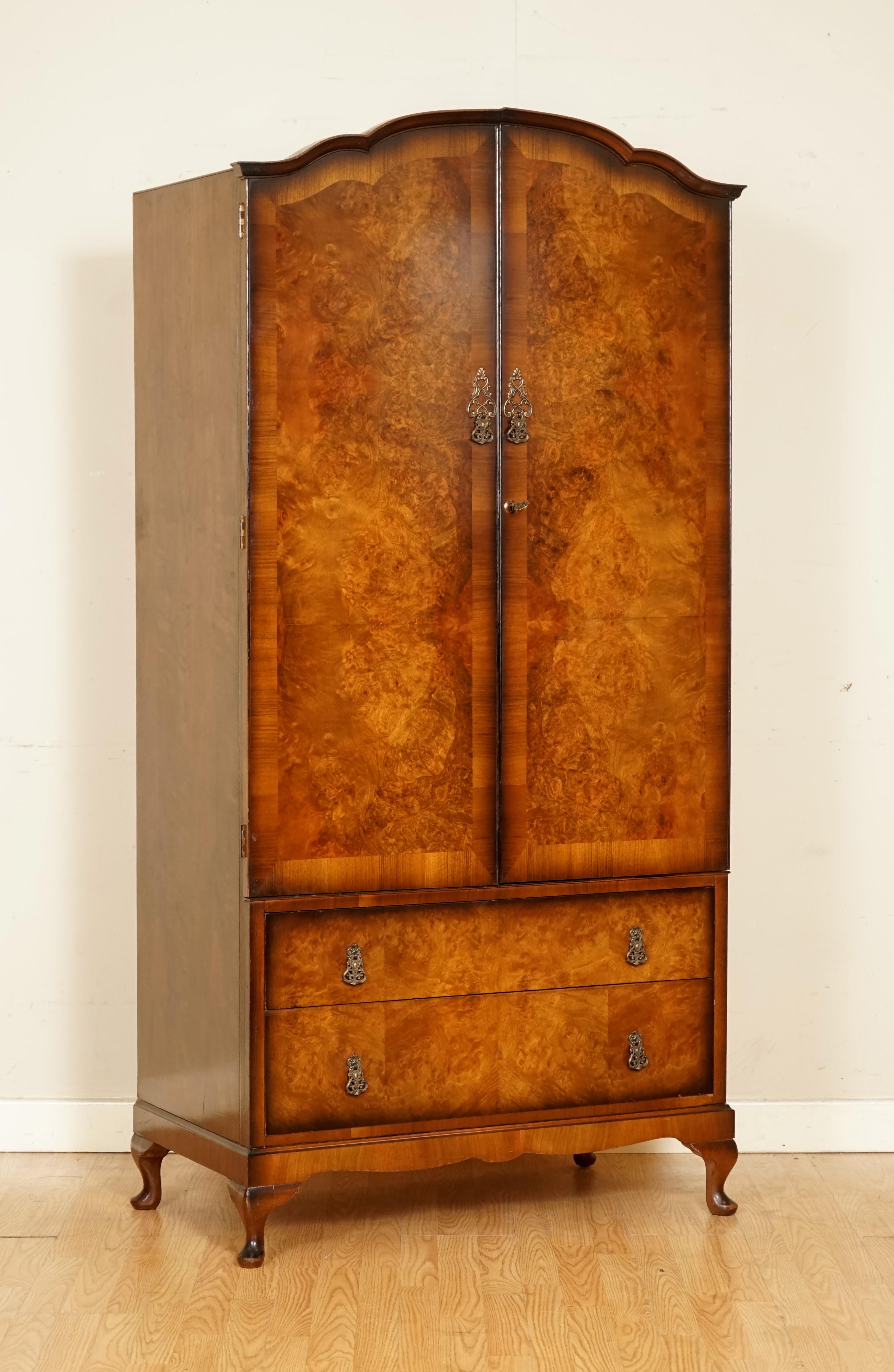 We are so excited to present to you this Art Deco Burr Walnut Wardrobe.

Inside the wardrobe there's a nice space on the left to hang items. Key is included.

On the right side there's space to put stuff away in two drawers and once compartment