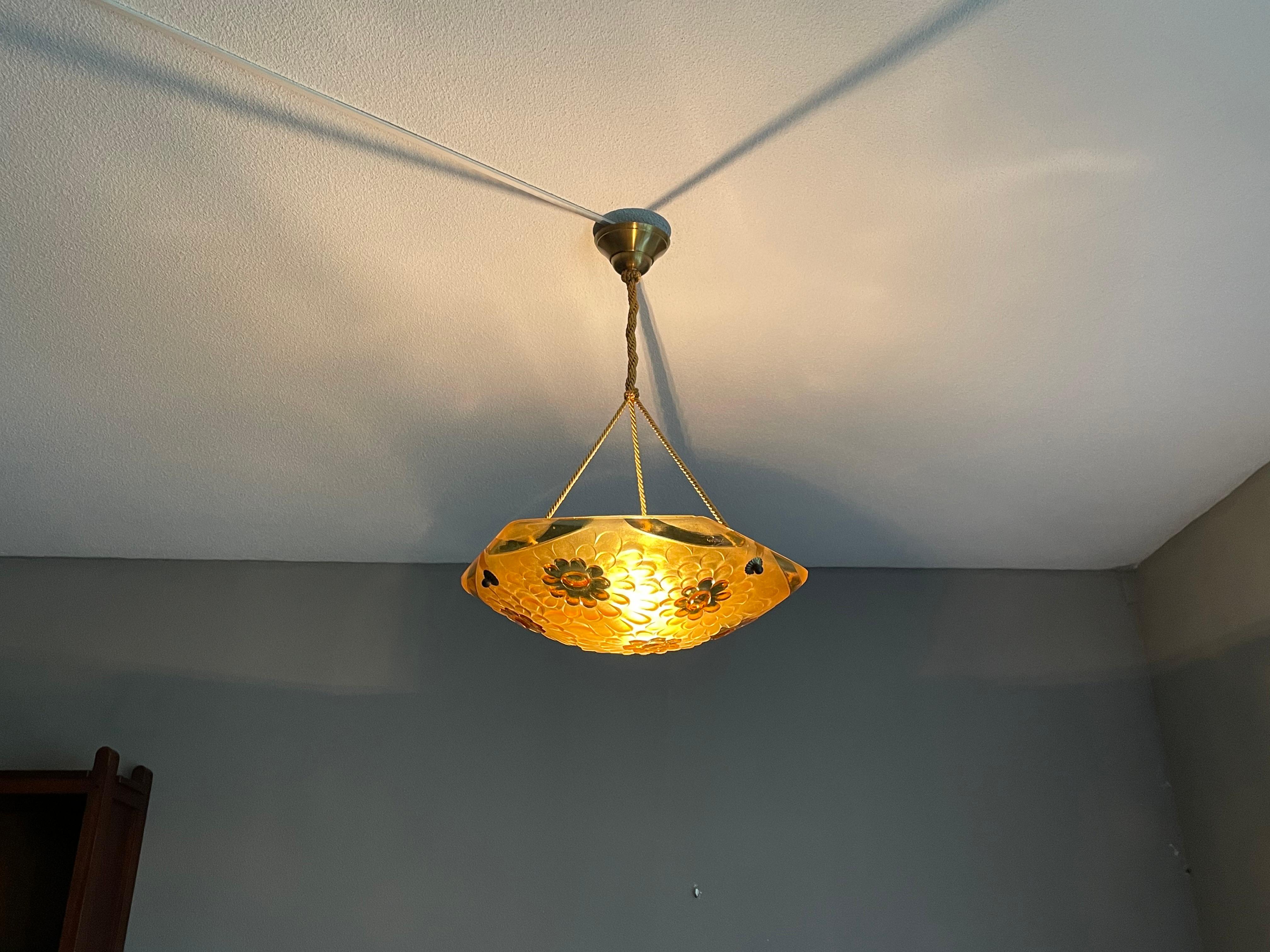 For the collectors of top quality and stylish Art Deco pendants.

This 1920s practical size chandelier is by one of France's finest when it comes to Art Deco light fixtures. For the well-to-do, Degue was one of the brands to choose, because his