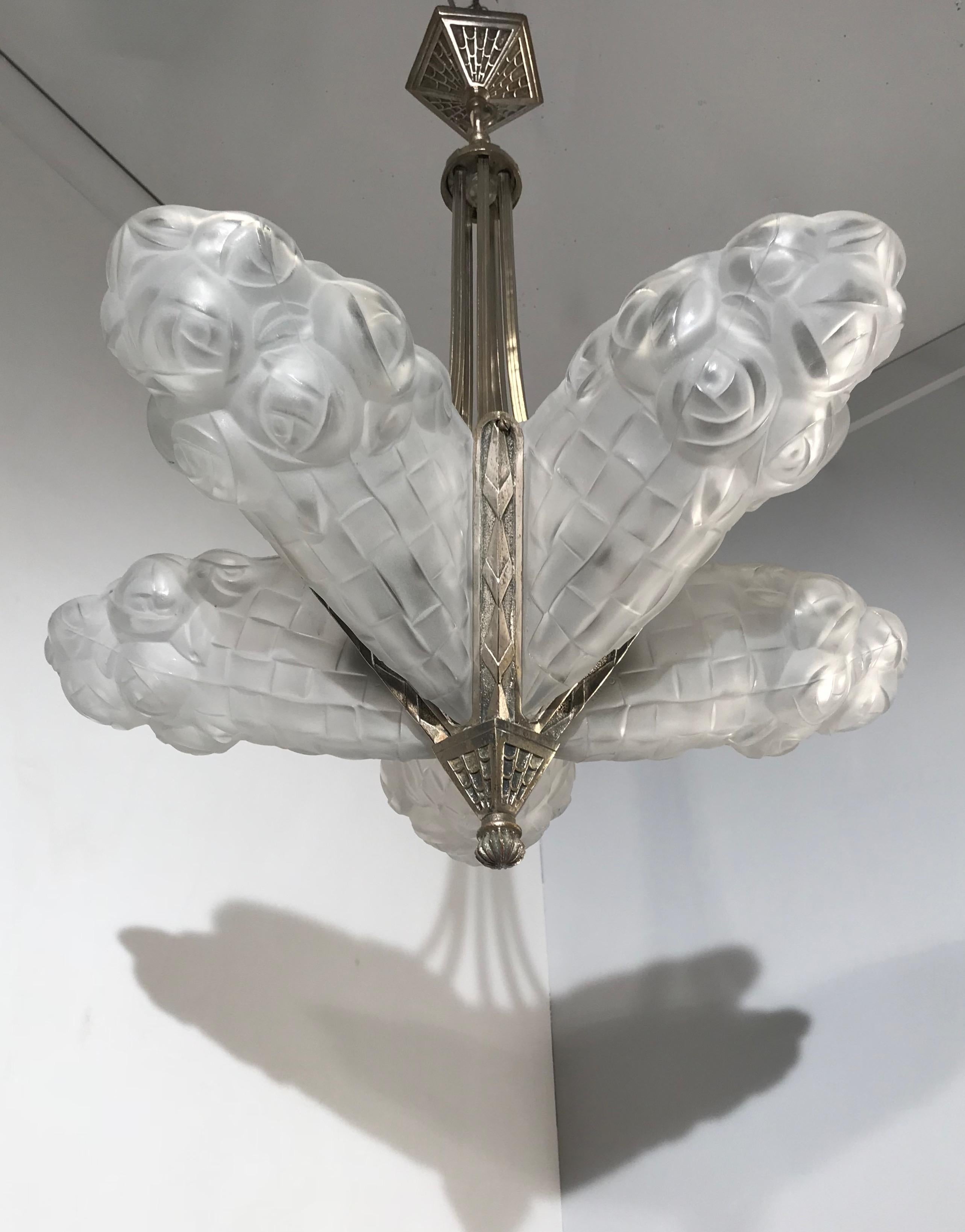 For the collectors of top quality stylish Art Deco pendants.

This early 20th century, practical size chandelier is by one of France's finest when it comes to Art Deco light fixtures. For the well-to-do, Degue was one of the brands to choose,
