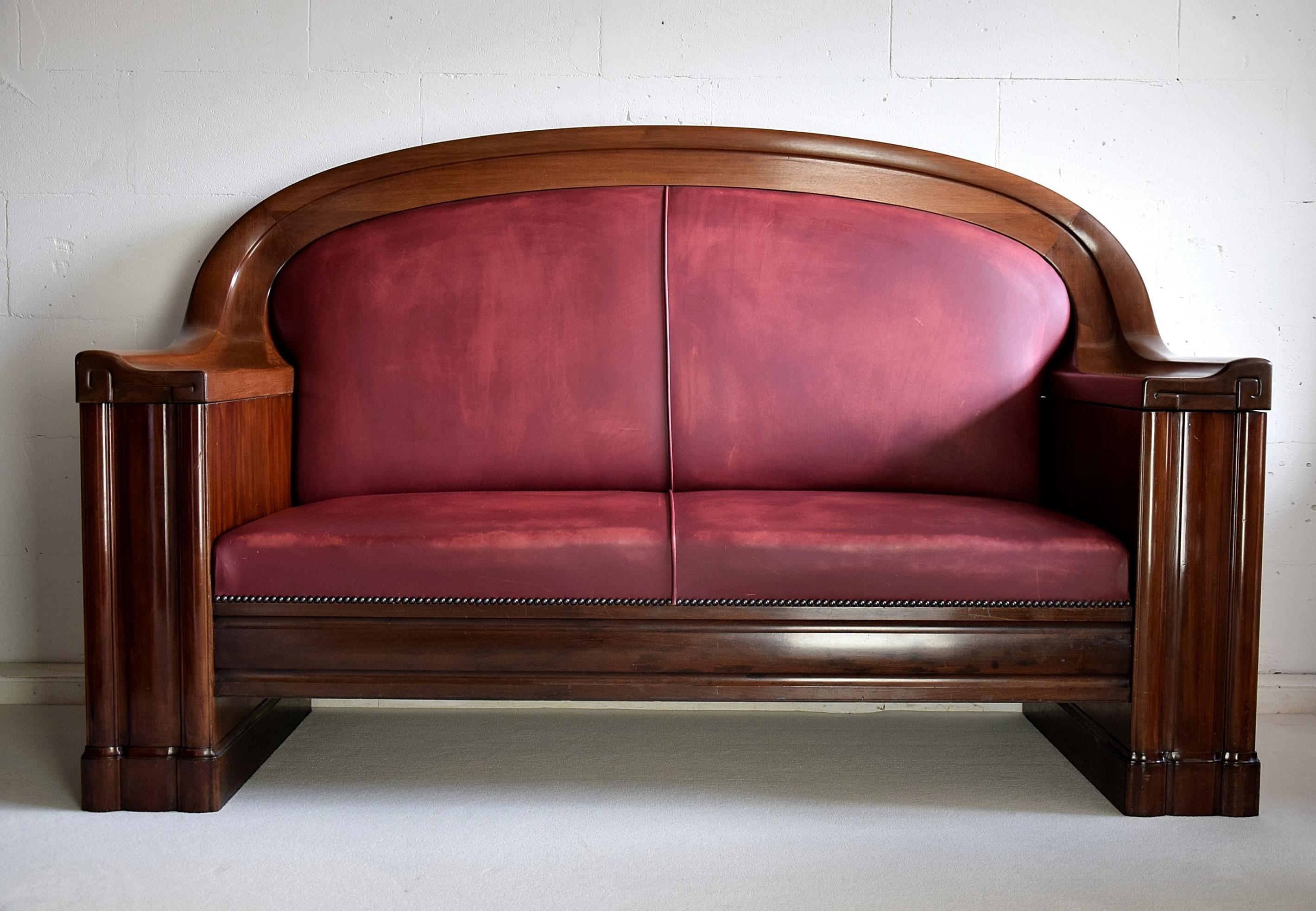 Sophisticated 1930 Danish Art Deco sofa produced by C.B. Hansens furniture makers appointed by the Danish Royal Court. This beauty has leather upholstery and a frame made of mahogany, stained Mahogany and darkened Italian Walnut. The sofa is in
