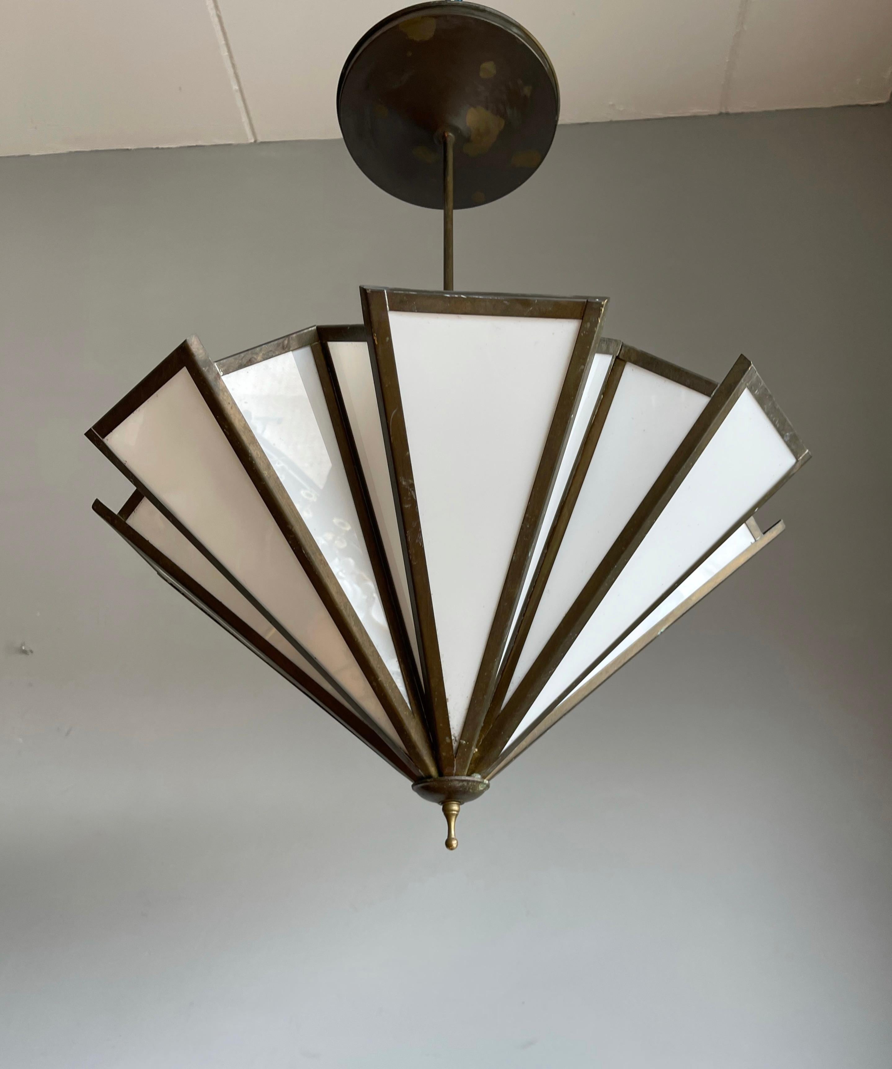 Unique and top quality made geometrical design, theater-style light fixtures.

The 1stdibs platform is known for offering the most beautiful things on earth and this timeless and stylish set of light fixtures undoubtedly fits that bill. The