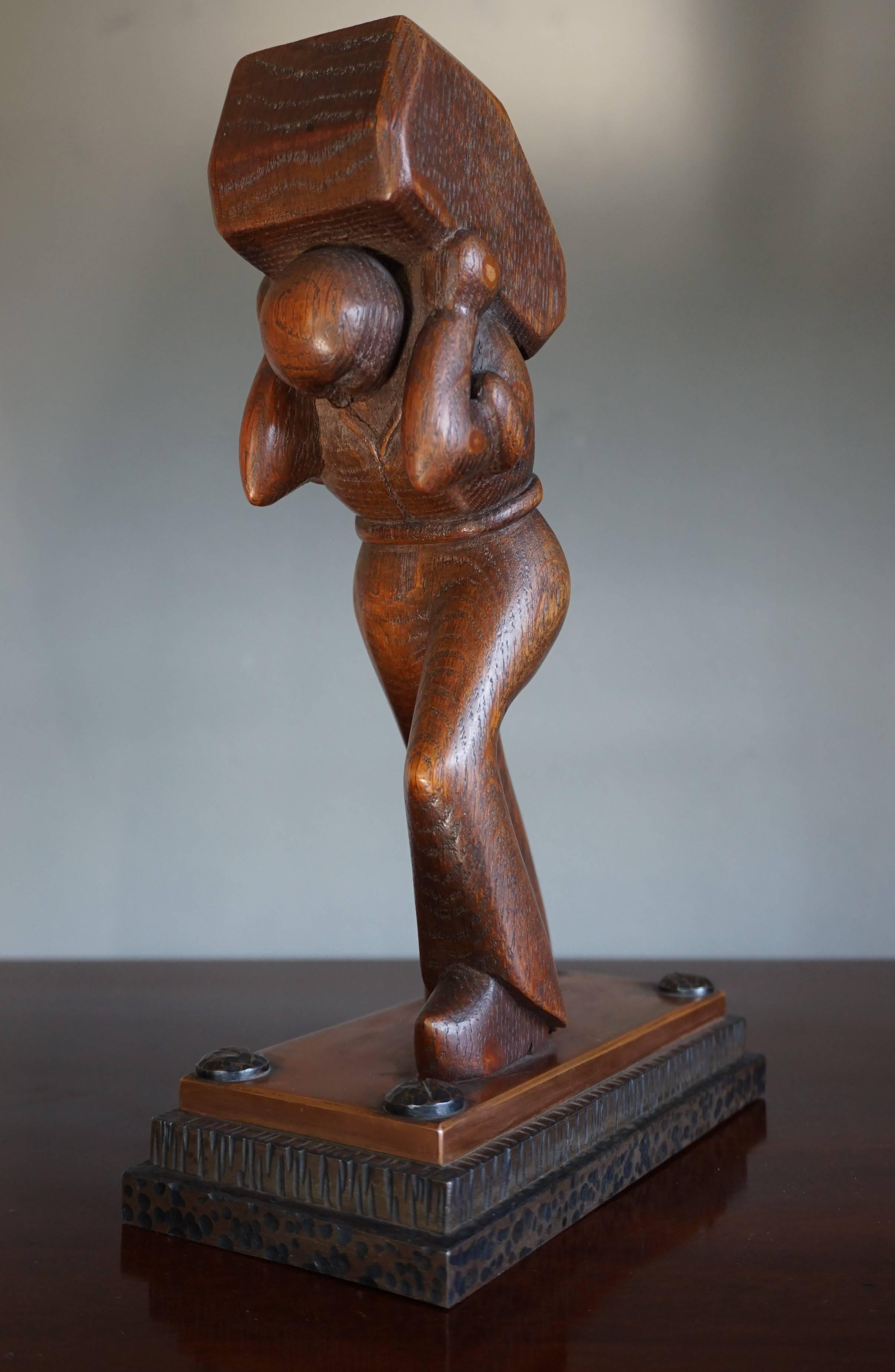 Stylized 1920s sculpture of a 'working class hero'.

This unique work of art from the early 20th century immediately caught our attention. The powerful statement that the artist has made with this incredibly stylish and strong sculpture leaves a