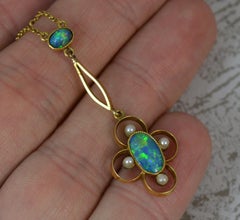 Stunning Art Nouveau 15 Carat Gold Black Opal and Seed Pearl Pendant