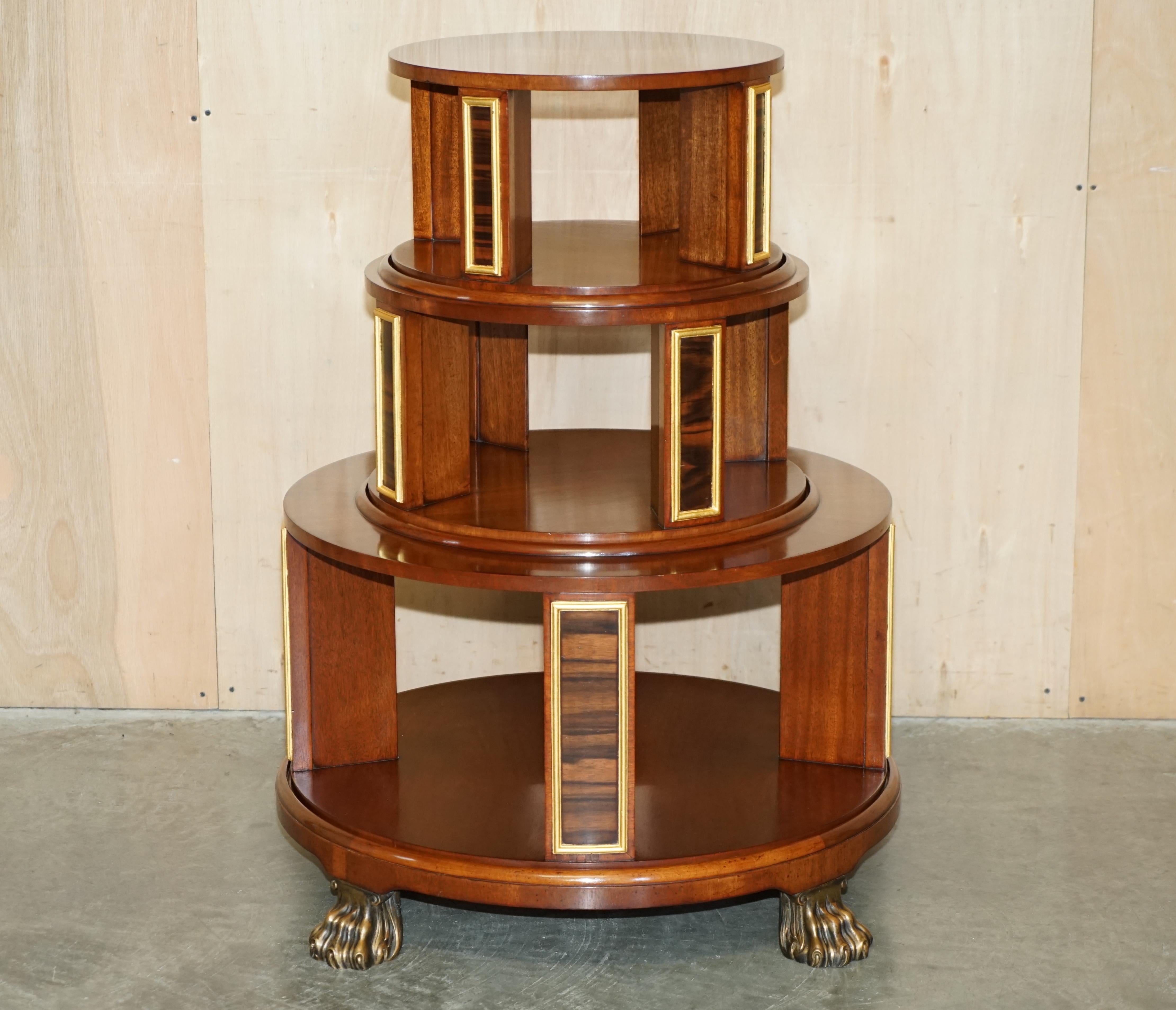 Royal House Antiques

Royal House Antiques is delighted to offer for sale this very unique, Arthur Brett of Norwich, hand made in England, Satinwood, Walnut & rosewood revolving bookcase table finished with Lion's hairy paw feet

Please note the