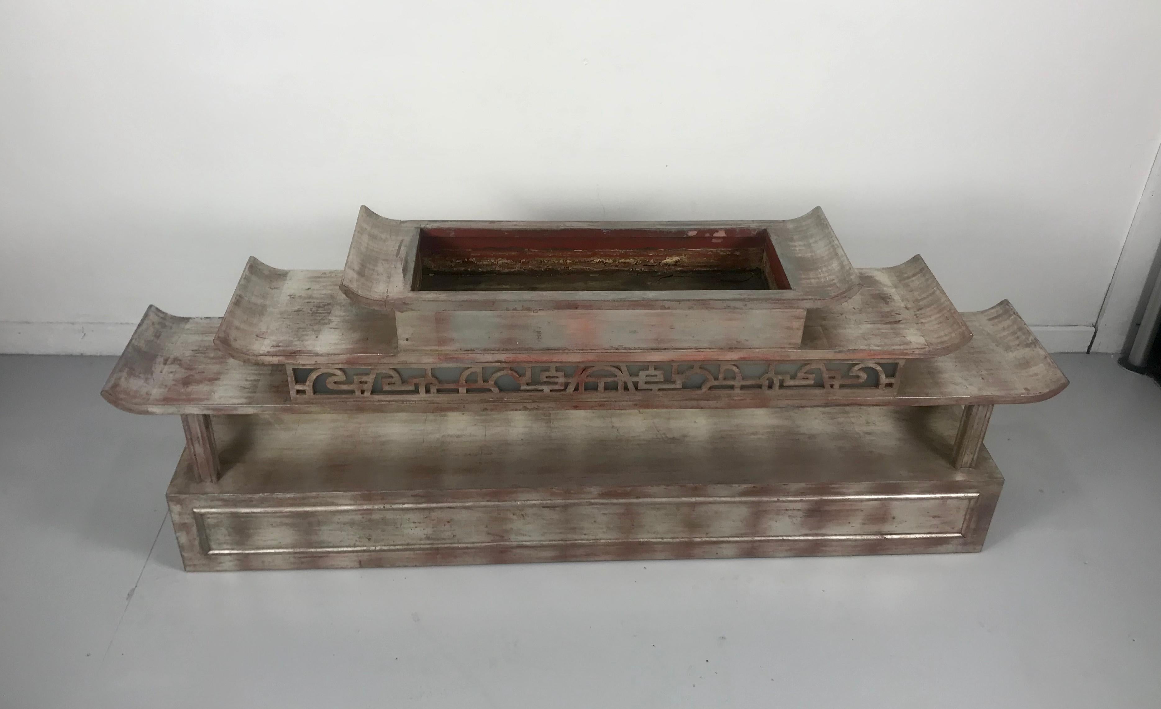 1940s silverleaf lighted plant display, console table designed by James Mont, an open top for a planter. Retains original wiring. Stunning design and proportion. Finished backside so can be used as room divider, Original finish, amazing patina,