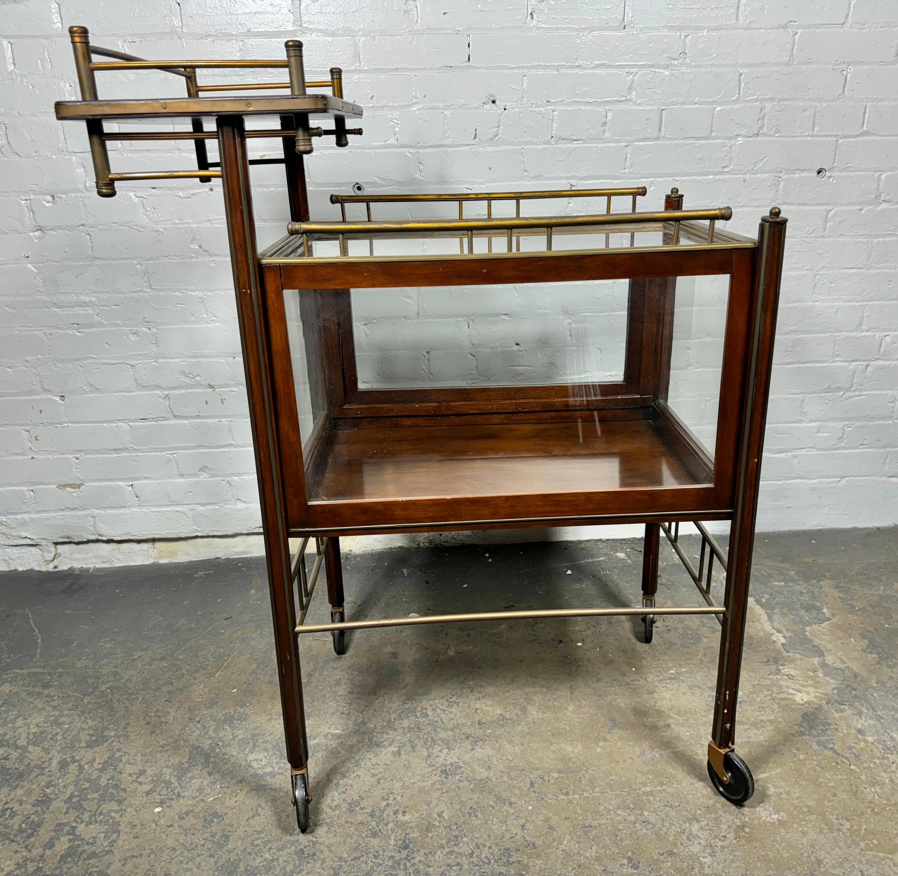 Modernist design Arts & Crafts drinks cart by Ernst Rockhausen of Waldheim, Germany.-wise this one of a kind drinks trolley on its original wheels is truly remarkable.
 The asymmetrical shape with its extra tier, for placing some bottles or glasses