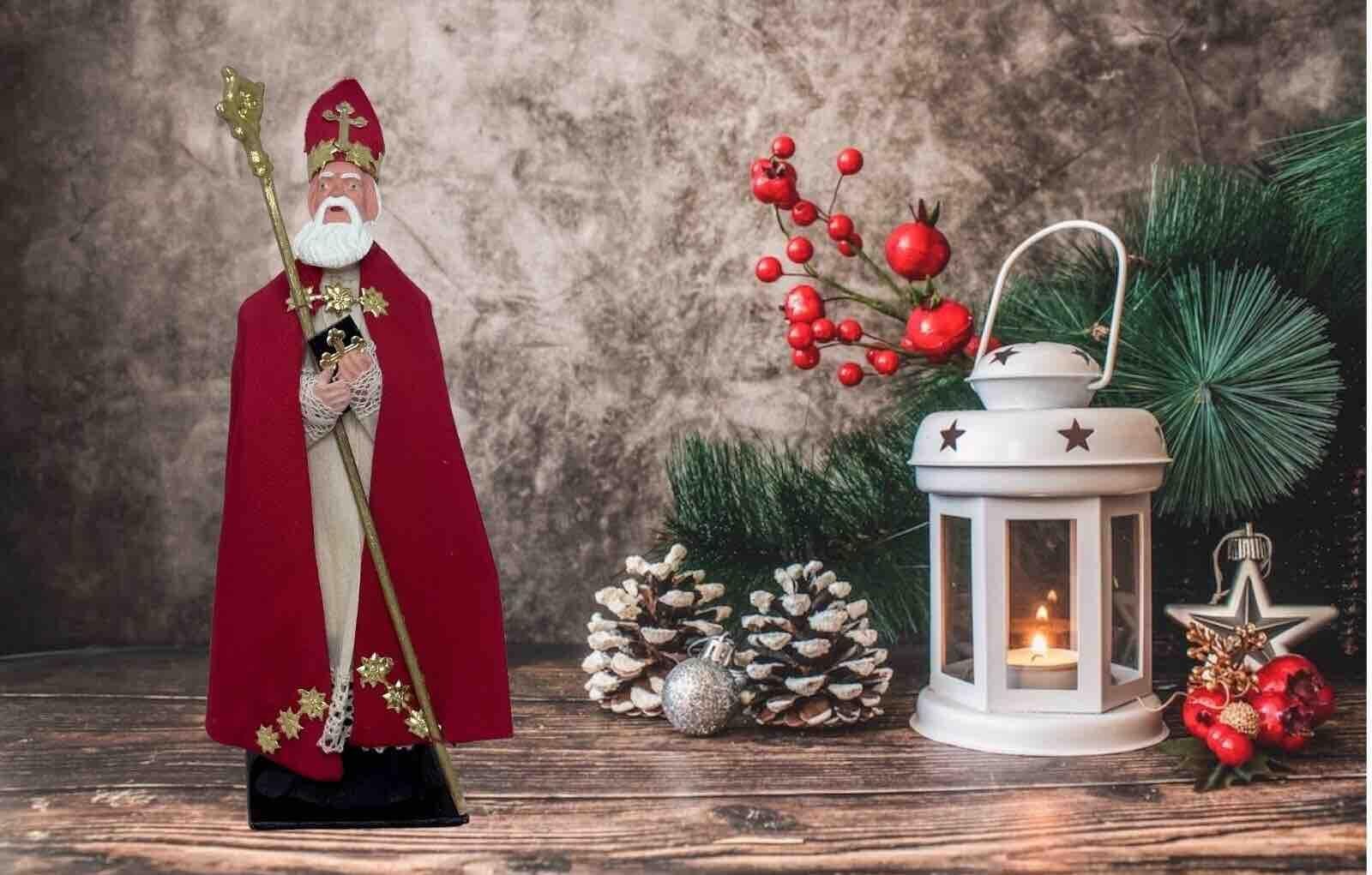 This vintage St.Nicholas, Santa Claus candy container made of composition, cardboard and Papermache was made in the 20th century and is a charming addition to any Christmas collection.  This original period piece was made in Austria and features a