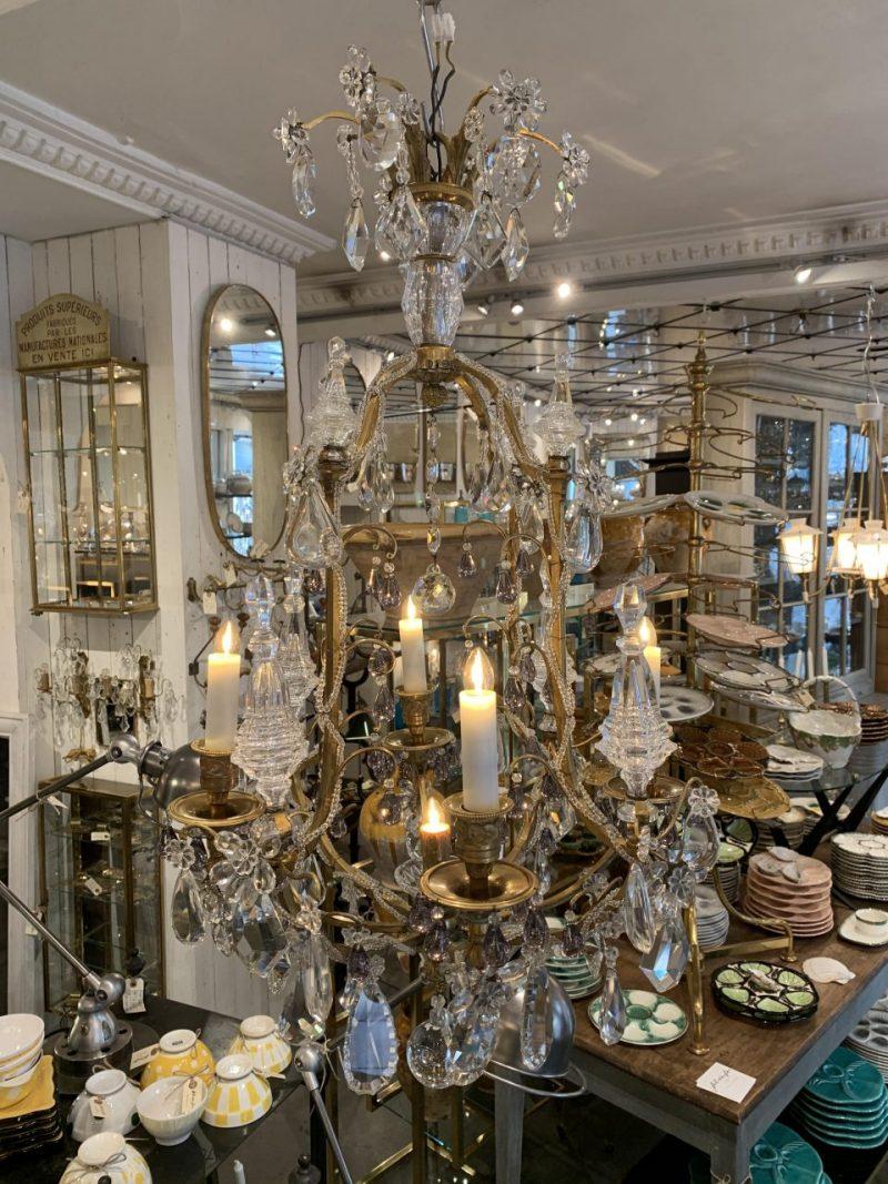 Fantastical crystal chandelier from circa 1920s France, and produced by the world renowned French glass company Baccarat, whose roots date back to 1764.

This lovely piece has 5 stunning opauqe glass pipes for electricity, and a beautiful cage