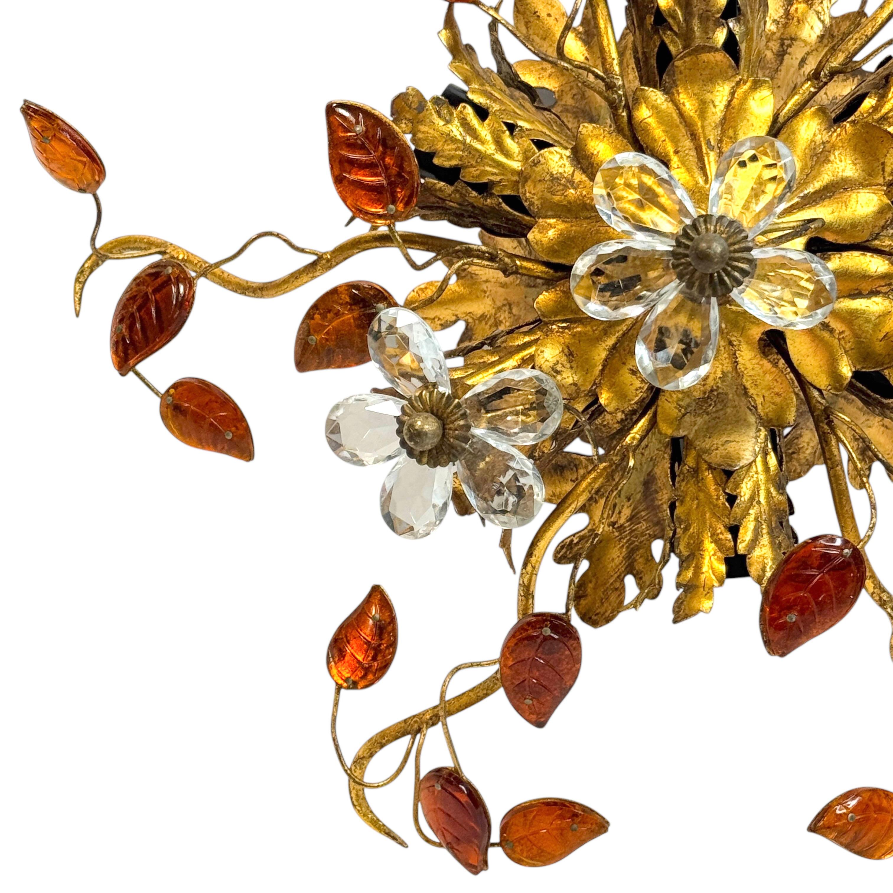 Add a touch of opulence to your home with this charming flush mount light. Perfect stunning gilt acanthus leaf design with clear Murano glass flowers and colored Murano glass leaves on fine gilt stems, to enhance any chic or eclectic home. We'd love