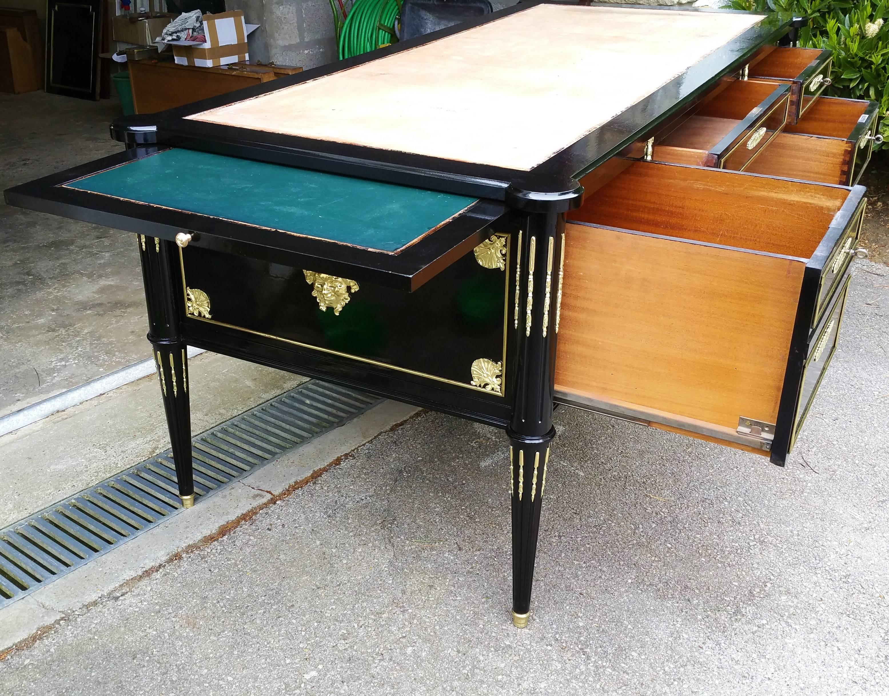 French big size thrree decorated facades table desk Napoleon III style with a rich ornamentation in gilt bronze .
With four drawers The two side facades hide a sliding table for extension making it yet much bigger.
With lock and key.

Dimension: