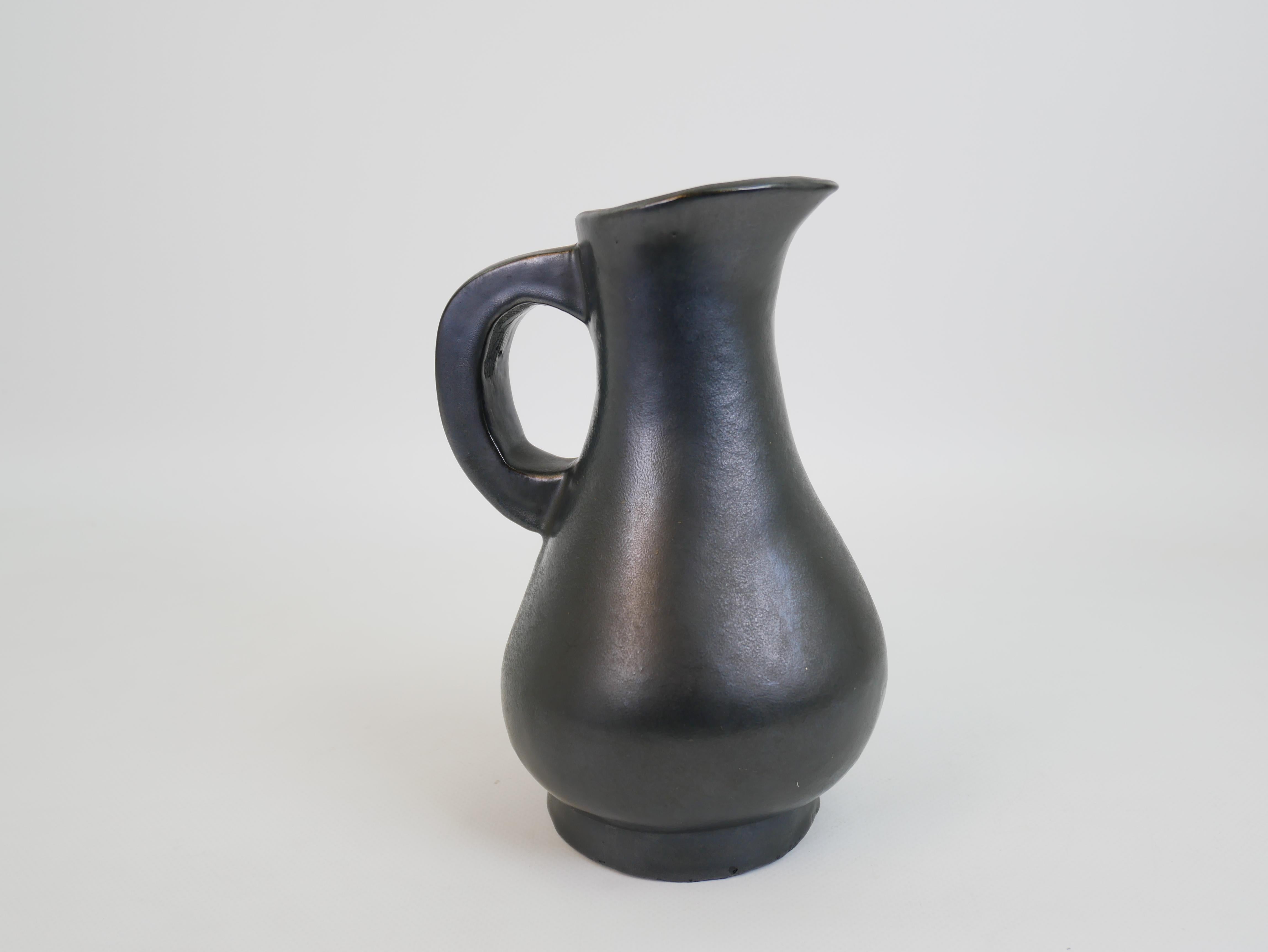 Mid-Century Modern Stunning black ceramic pitcher in the style of Georges Jouve circa 1950 For Sale