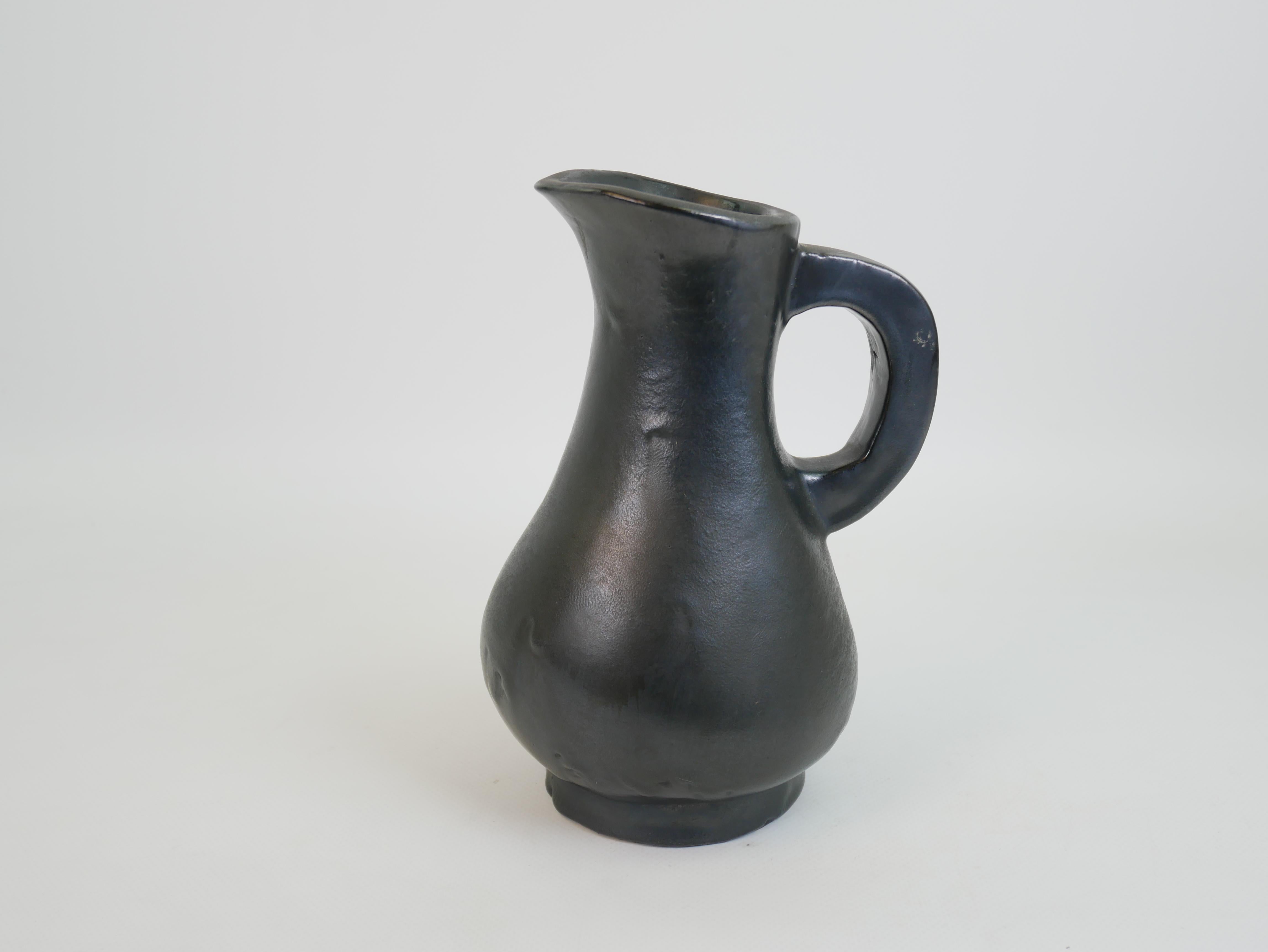 Ceramic Stunning black ceramic pitcher in the style of Georges Jouve circa 1950 For Sale