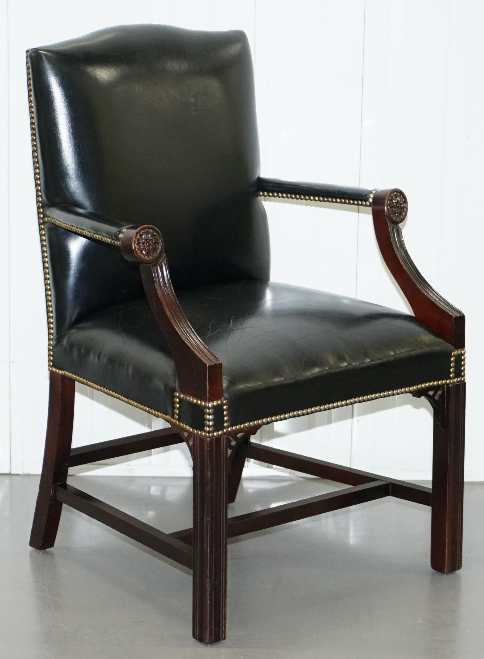 We are delighted to offer for sale this stunning vintage black leather chrome stud Gainsborough carver armchair with Thomas Chippendale style fret work carving

A very good looking and well made armchair, there are a lot of Gainsborough type