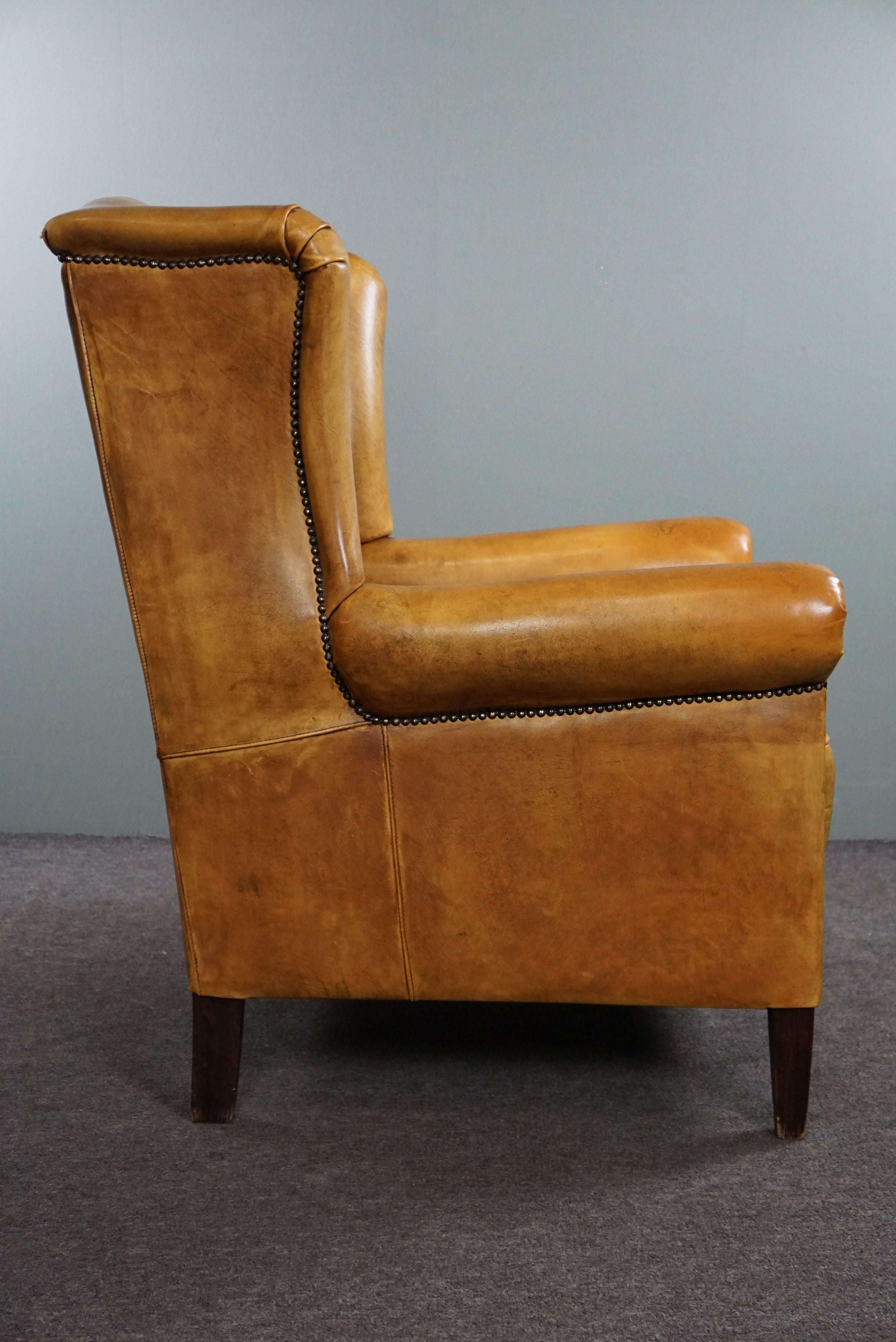 Hand-Crafted Stunning blonde cowhide leather wing chair For Sale