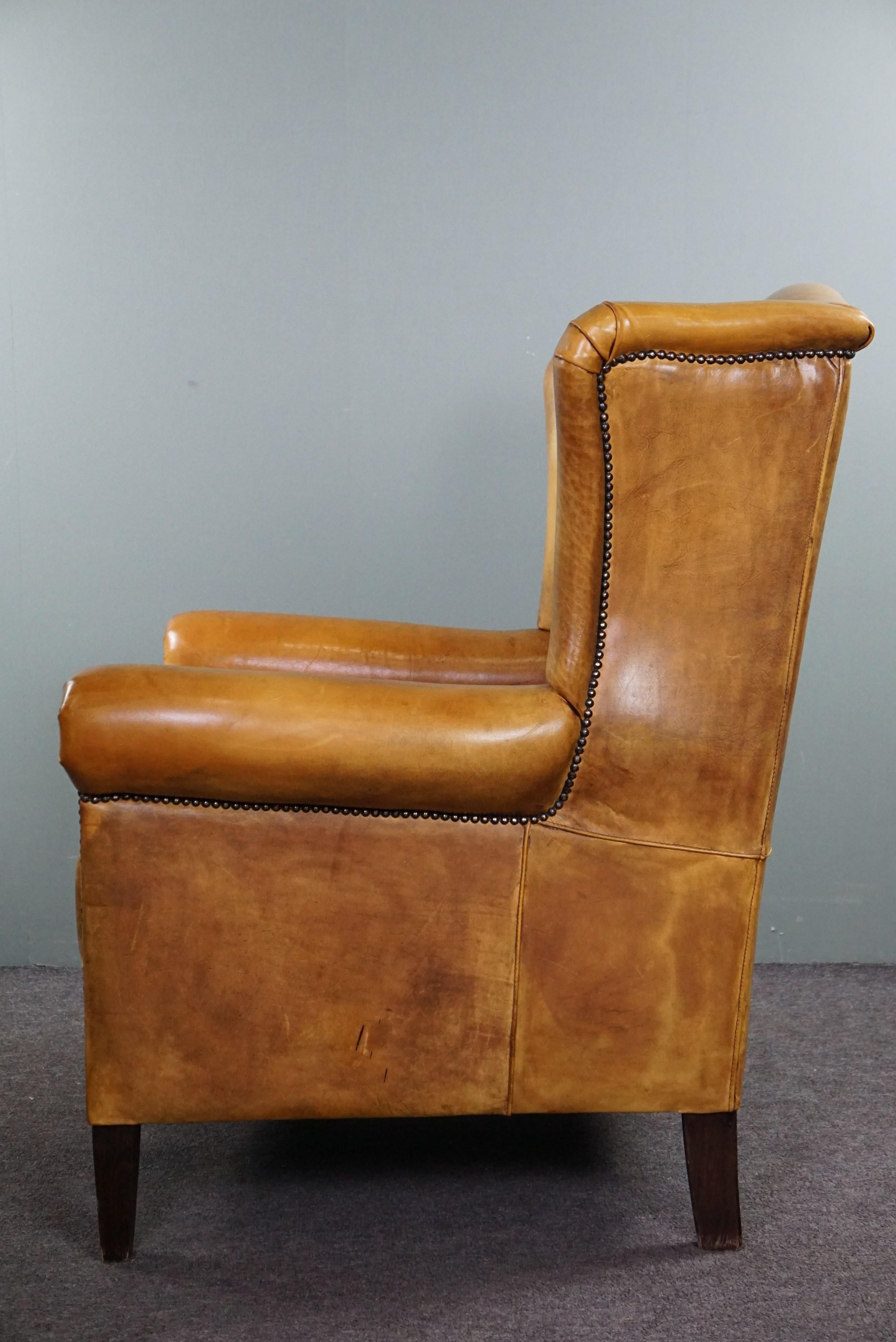 20th Century Stunning blonde cowhide leather wing chair For Sale