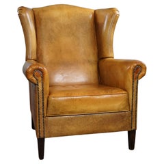 Stunning blonde cowhide leather wing chair