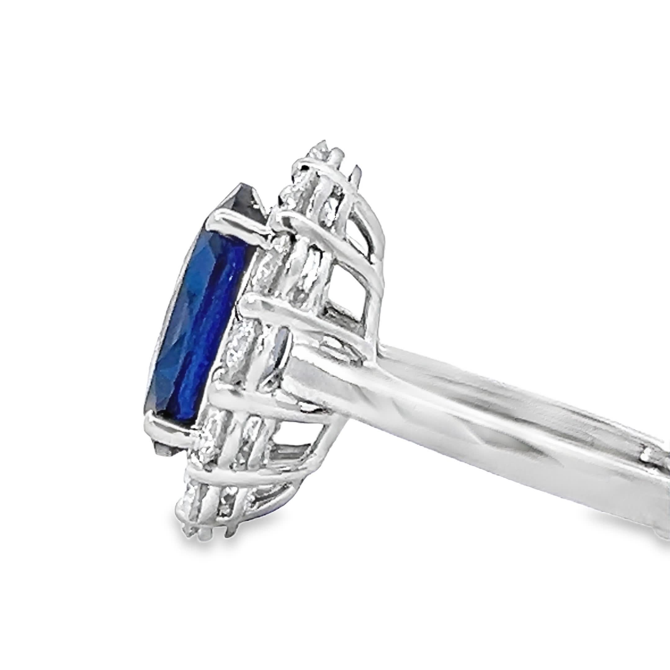 This exquisite ring features a captivating blue gemstone at its center, surrounded by a halo of sparkling diamonds. Crafted with precision, it embodies elegance and sophistication, making it the perfect accessory for any occasion.