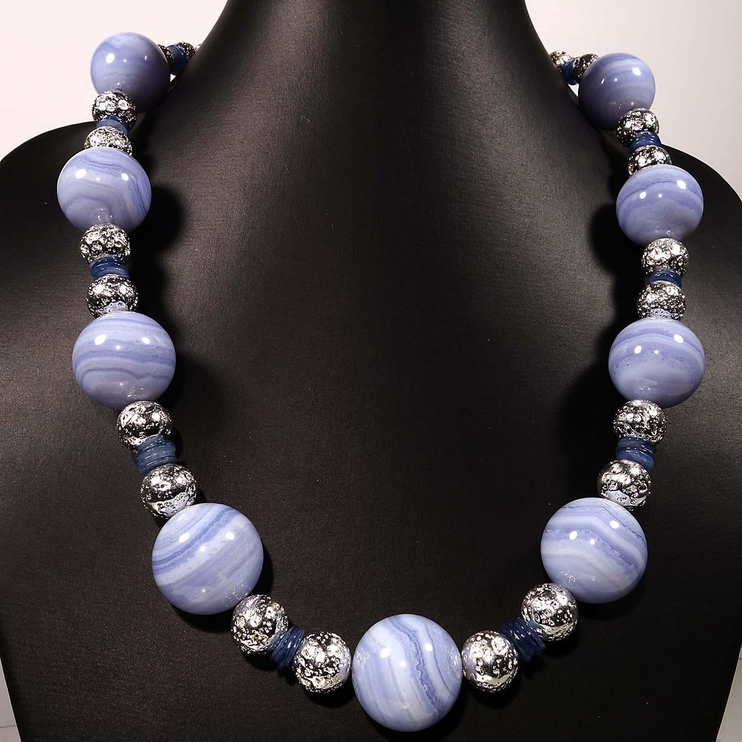 Custom made, 20 inch necklace with large Blue Lace Agate stations accented with Silver lava rock and thin slices of Kyanite.  This one of a kind necklace will enhance whatever you.  This lovely necklace is secured with a Silver toggle clasp.  See