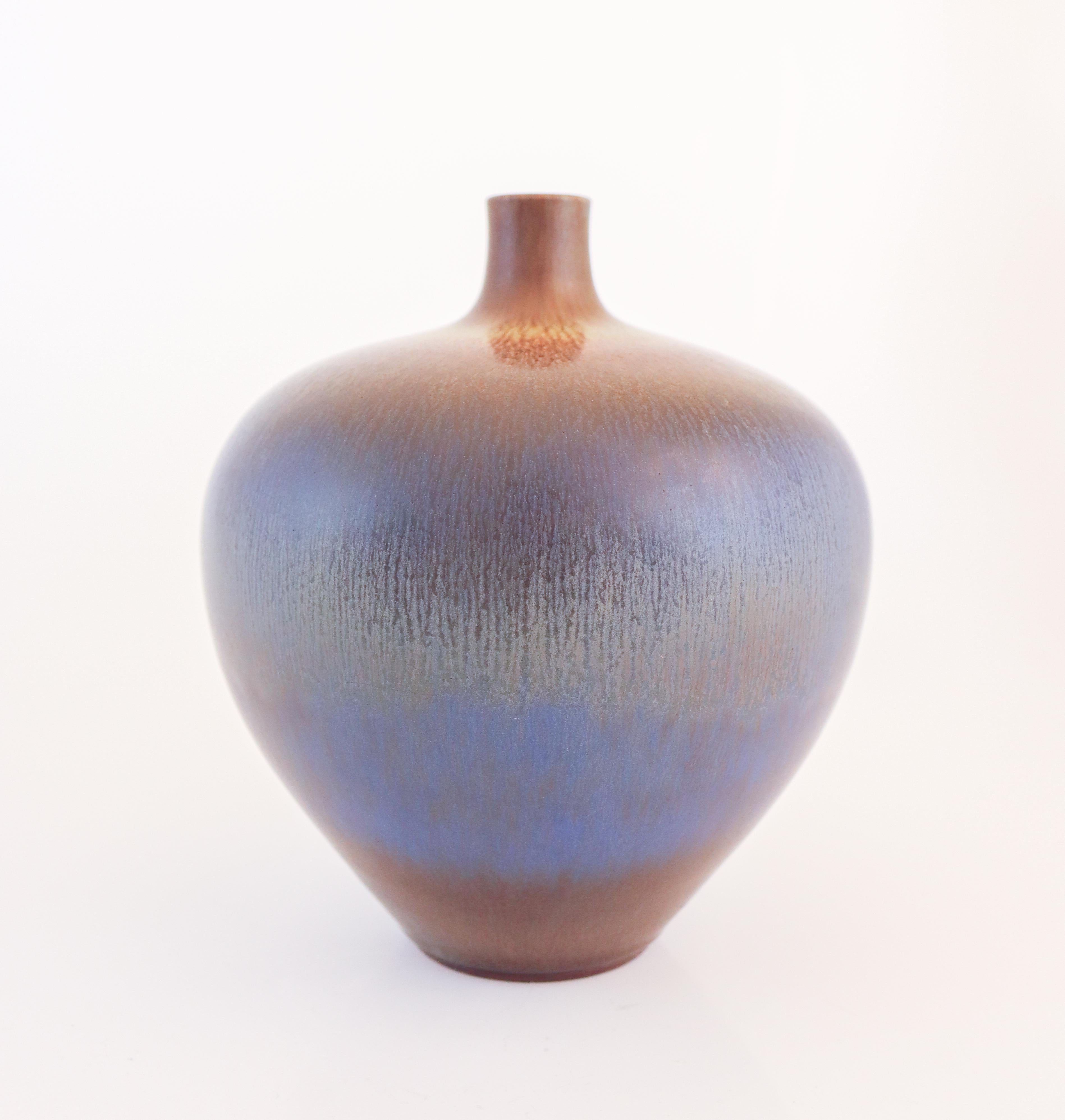 A stunning, large stoneware vase by Berndt Friberg at Gustavsberg designed in 1963, the vase has a lovely har-fur glaze in blue and brown. The vase is 20 cm (8