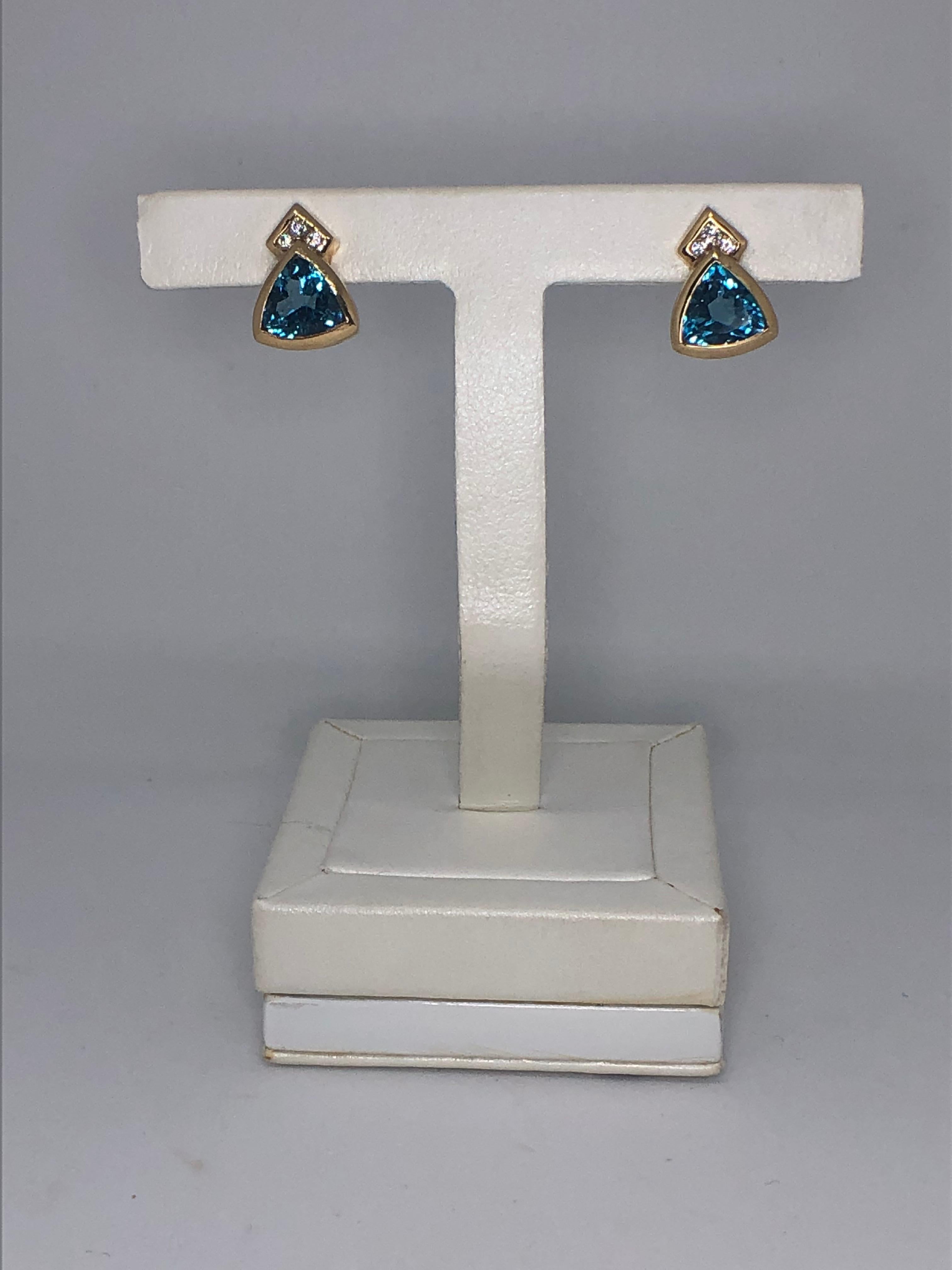 Women's Stunning Blue Topaz and Diamond Earrings in 14 Karat Yellow Gold For Sale
