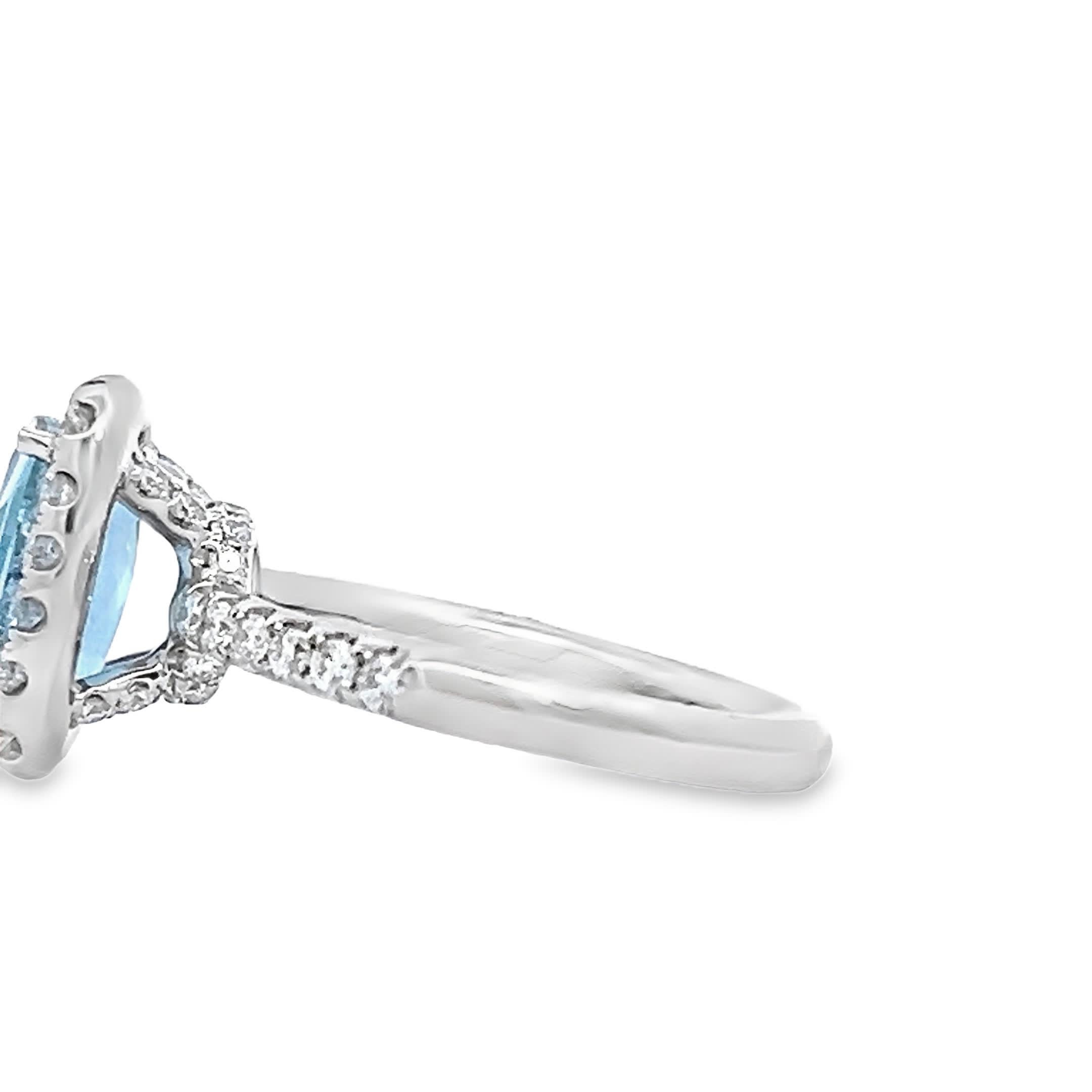 This exquisite ring features a captivating blue topaz at its center, surrounded by a halo of sparkling diamonds. Crafted with precision, it embodies elegance and sophistication, making it the perfect accessory for any occasion. Whether you're