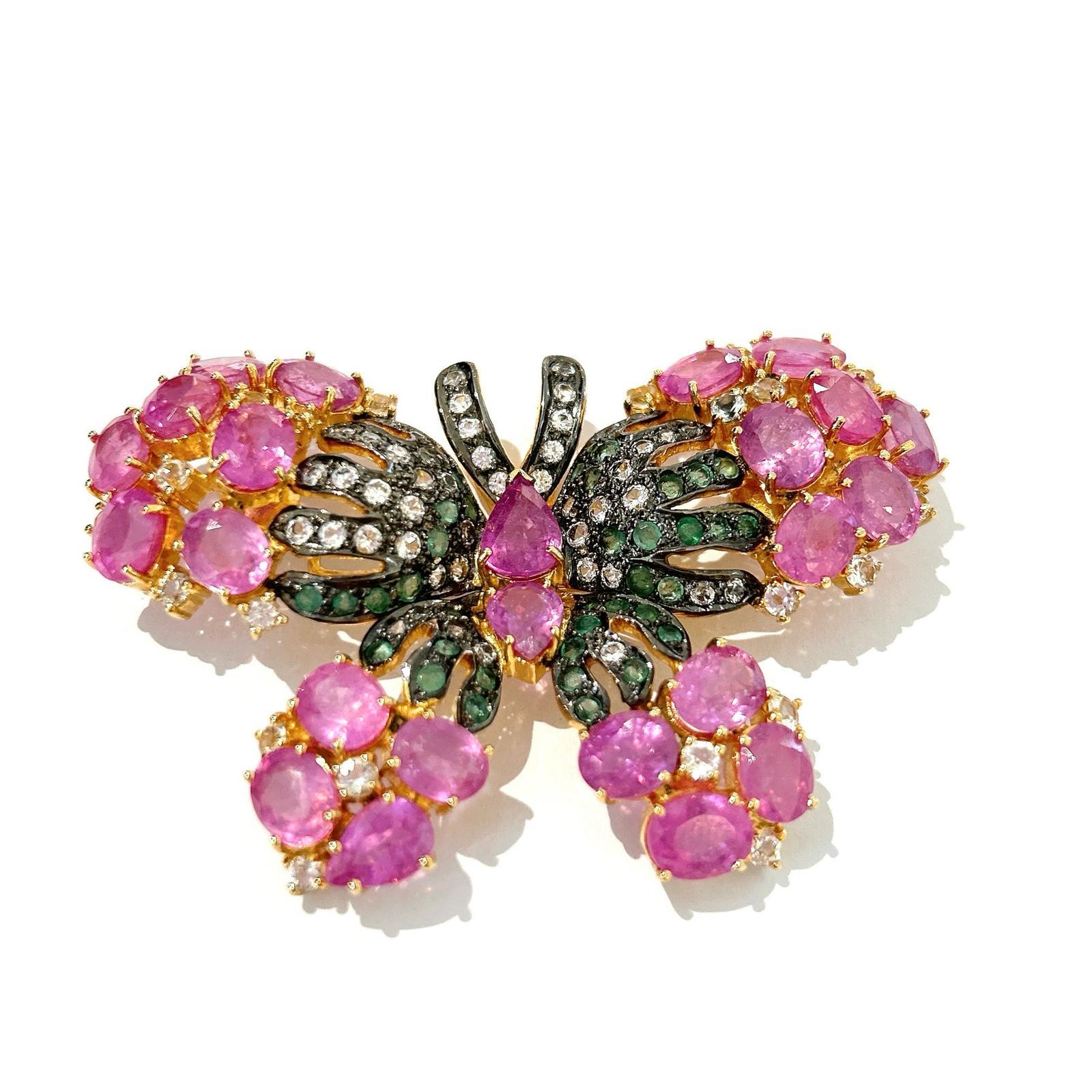 Bochic “Orient” Multi Sapphires & Ruby Brooch Set In 18K Gold & Silver 

Can be worn as a brooch and a pendant 

Natural light Fancy Pink/Red Ruby  - 30 carat 
Multi color Natural Sapphires from Sri Lanka 
1.00 carat
Natural Emeralds  - 2.50 carats
