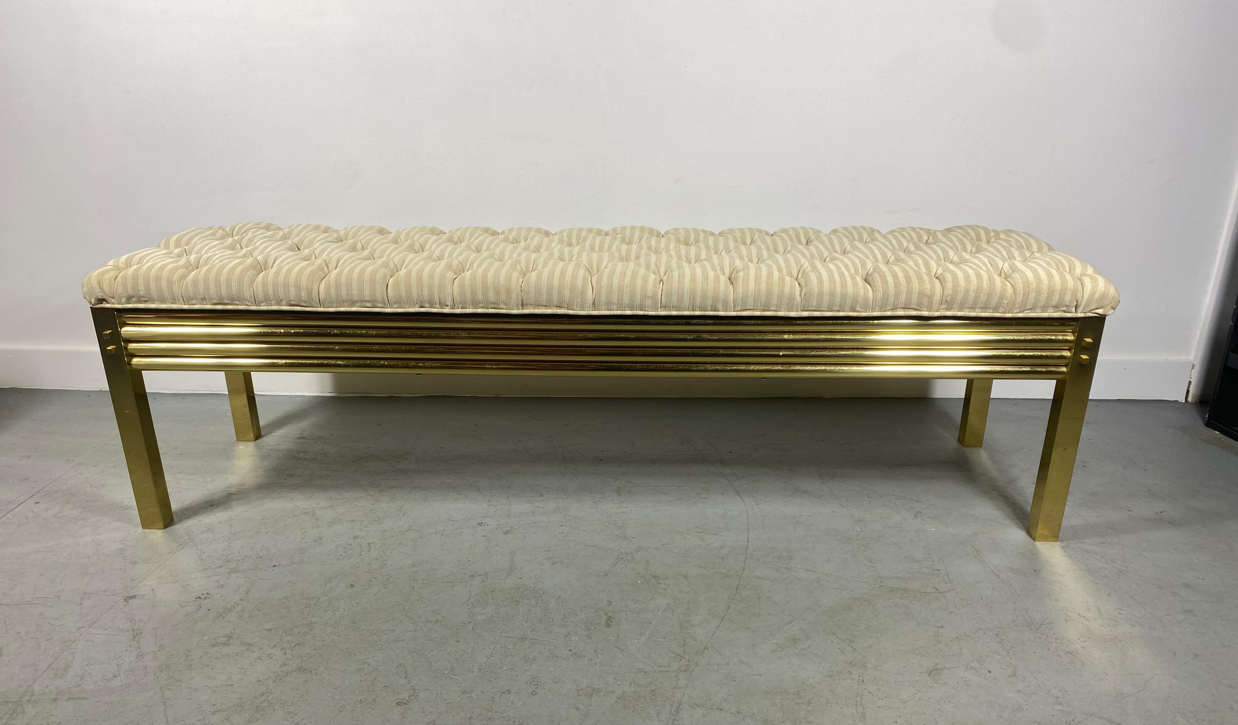 Stunning brass and tufted top bench, manner of Karl Springer, Pierre Cardin. Simple, elegant design. Fit seamlessly into any Modernist, Contemporary, Antique environment. superior quality and construction. Retains original fabric. Hand delivery